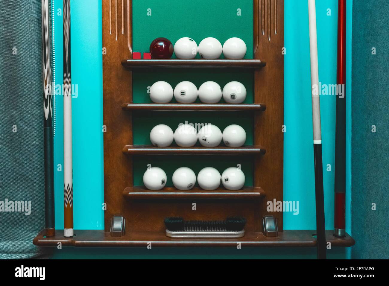 Shelf with white balls and billiards equipment Stock Photo Alamy