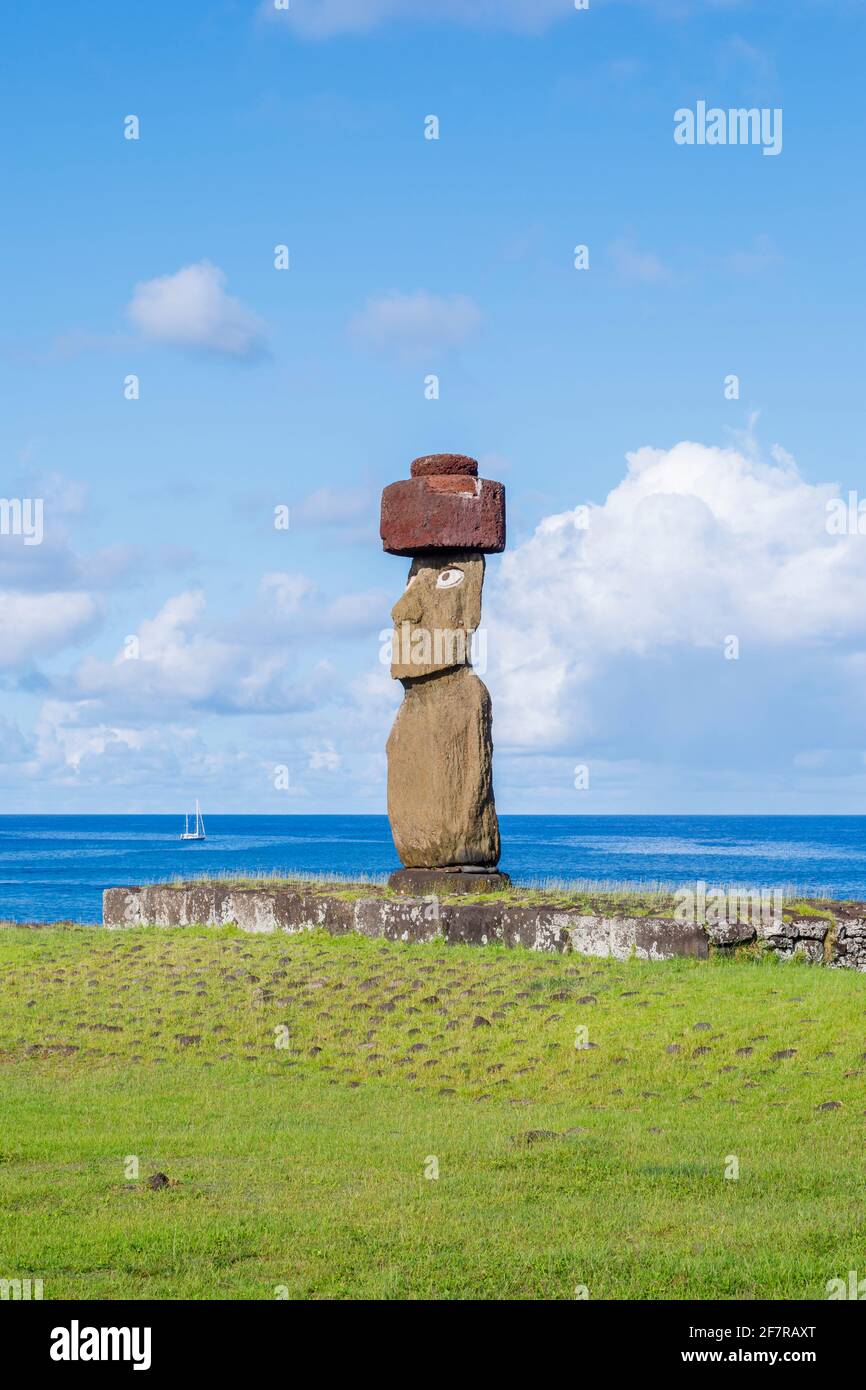 Restored Ahu Ko Te Riku moai (statue) with eyes and topknot, its back to the Pacific Ocean coast at Tahai, Hanga Roa, Easter Island (Rapa Nui), Chile Stock Photo