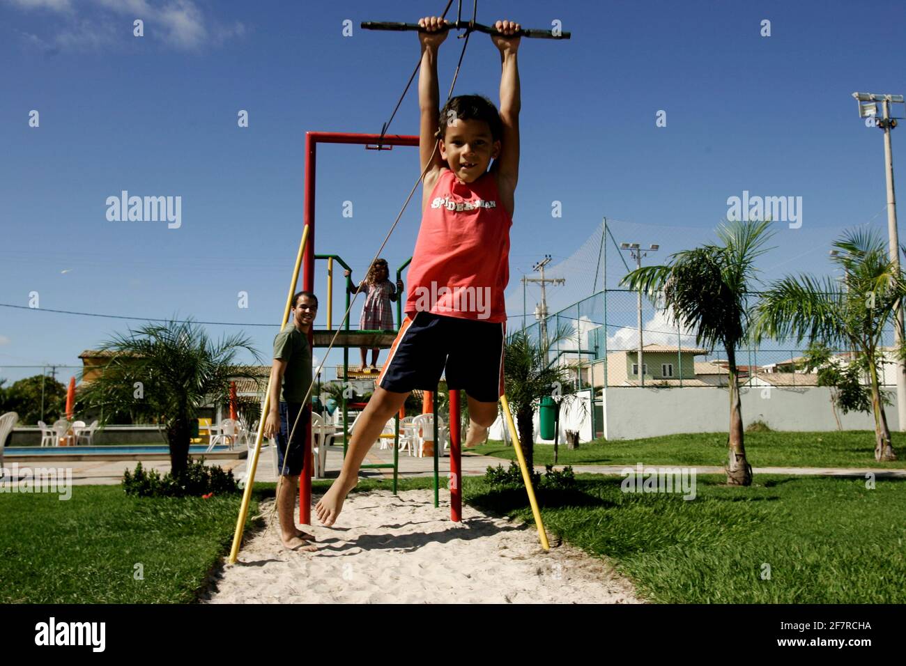 salvador, bahia / brazil - june 27, 2009: child is seen playing on zip lines in a condominium boat in the city of Salvador. Stock Photo