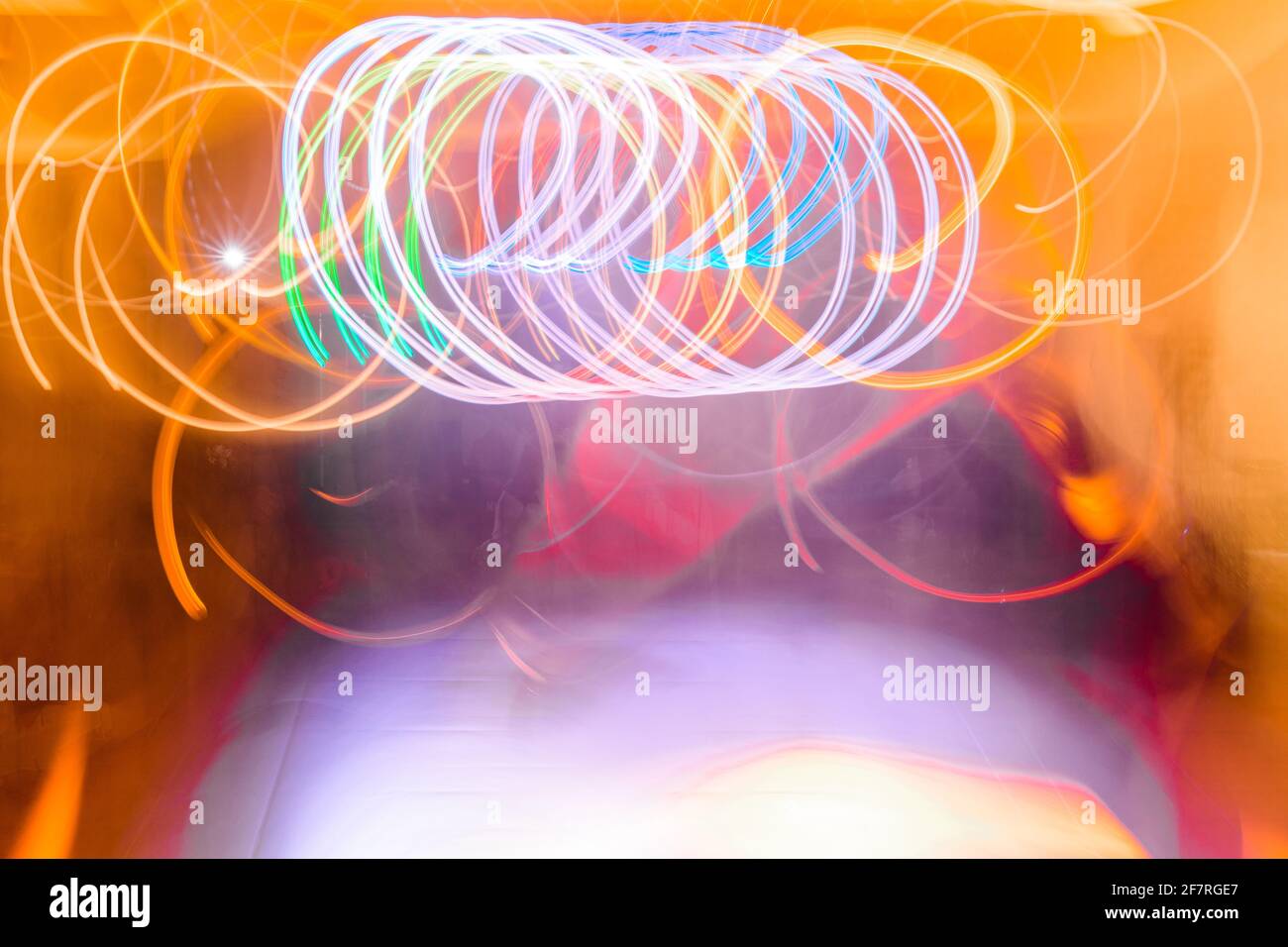 Photograph of moving light emitted by a rotating lamp showing images in ...