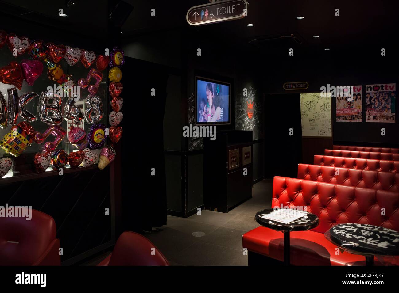 Horizontal view of the interior of the AKAB48 Cafe dedicated to the AKAB48 Japanese idol group, Akihabara, Tokyo, Japan Stock Photo