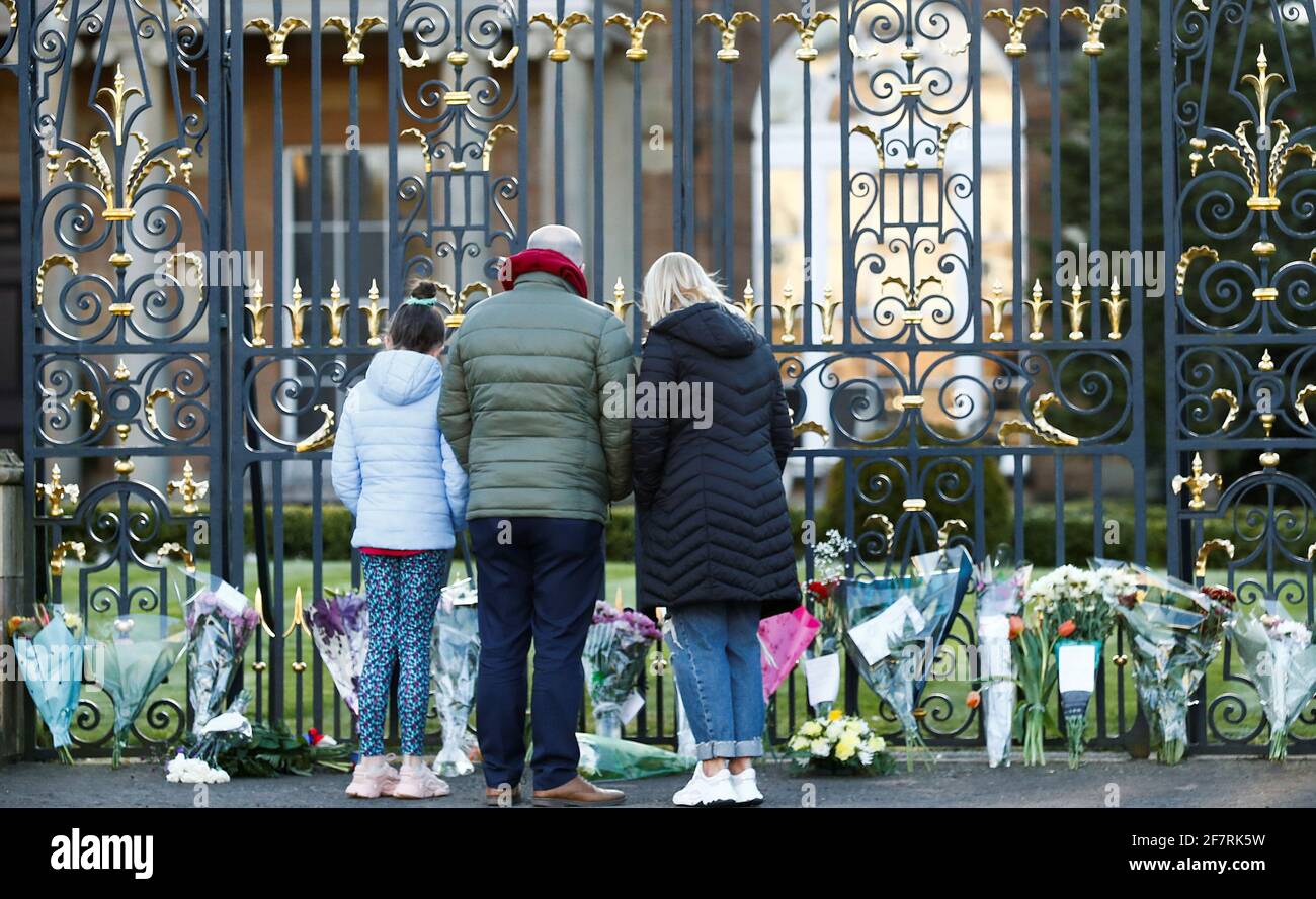 People bring flowers to Hillsborough Castle after Britain's Prince Philip, husband of Queen Elizabeth, died at the age of 99, in Hillsborough, Northern Ireland, April 9, 2021. REUTERS/Jason Cairnduff Stock Photo