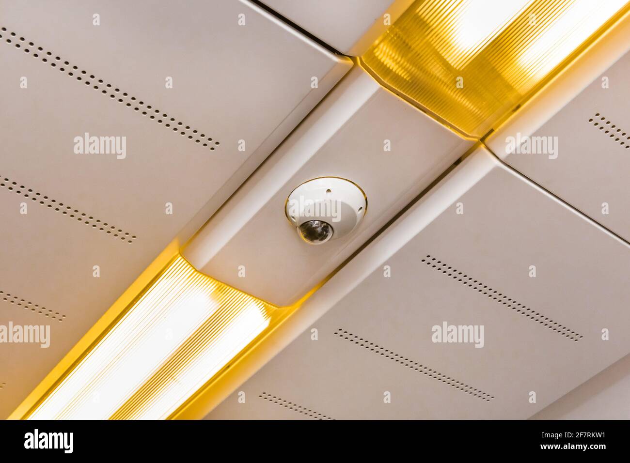 Surveillance camera on the ceiling of a modern electric train stadler. Stock Photo