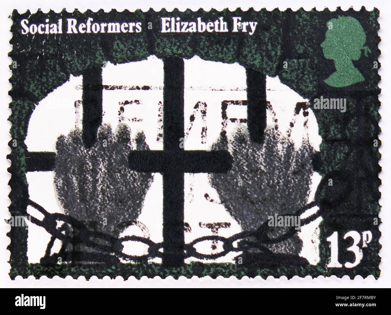 MOSCOW, RUSSIA - JANUARY 17, 2021: Postage stamp printed in United Kingdom shows Hands clutching Prison Bars (Elizabeth Fry), Social Reformers serie, Stock Photo