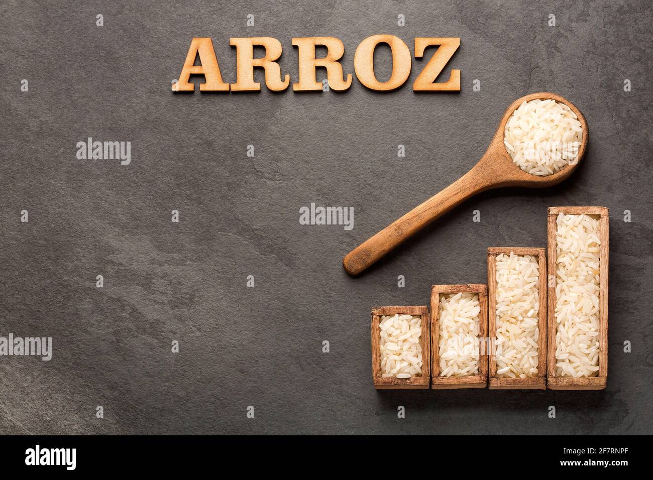 Brown Rice Title Oryza sativa - Raw white rice. Title in wooden letters Stock Photo - Alamy