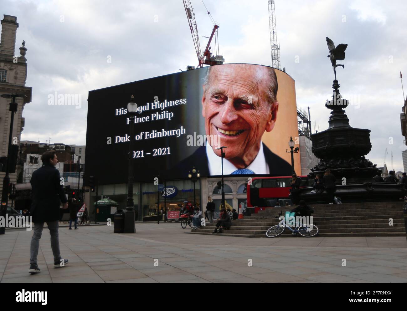 London, England, UK. 9th Apr, 2021. Prince Philips picture is displayed on the big screen at Piccadilly Circus as a tribute after the official announcement his death. Philip died at the age of 99 today. Credit: Tayfun Salci/ZUMA Wire/Alamy Live News Stock Photo