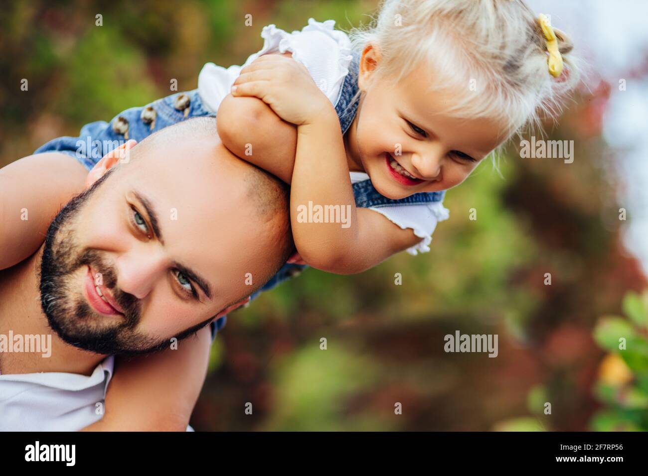 Father walks with daughter in the autumn forest Stock Photo - Alamy