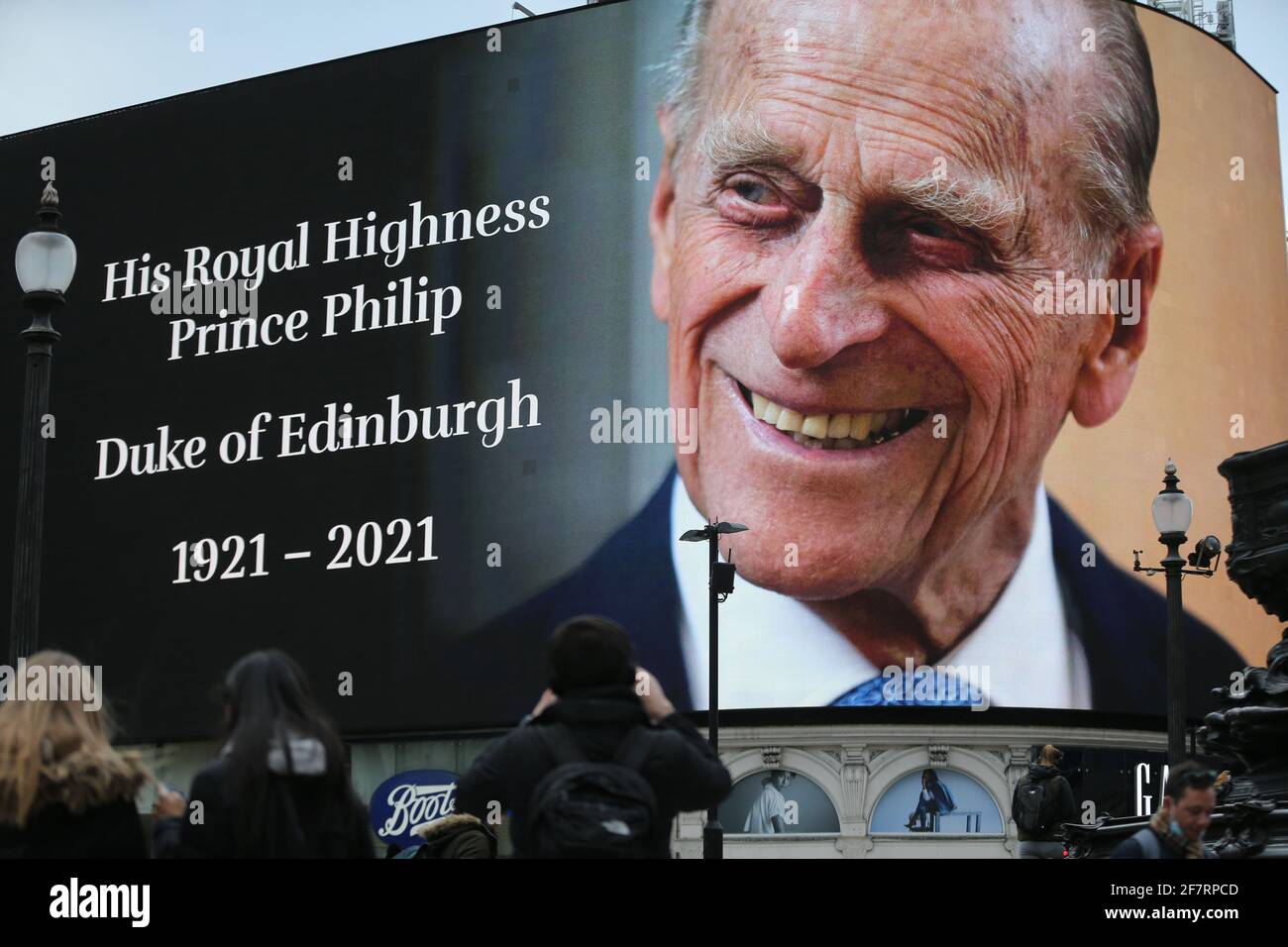London, England, UK. 9th Apr, 2021. Prince Philip's picture is displayed on the big screen at Piccadilly Circus as a tribute after the official announcement his death. Philip died at the age of 99 today. Credit: Tayfun Salci/ZUMA Wire/Alamy Live News Stock Photo