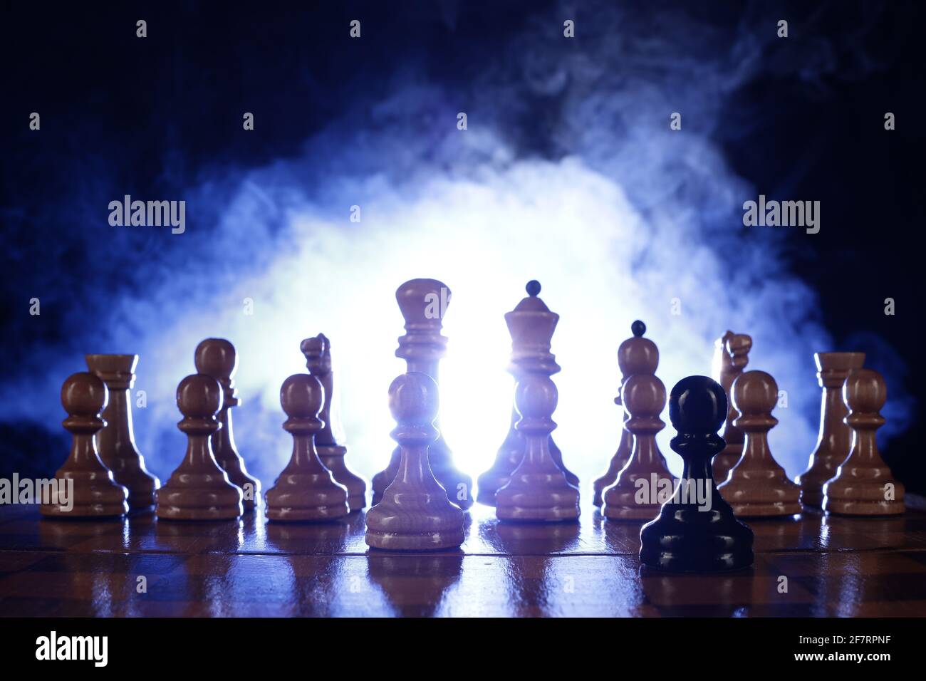 Chess is a board game. Chess pieces on a dark background in smoke Stock  Photo - Alamy