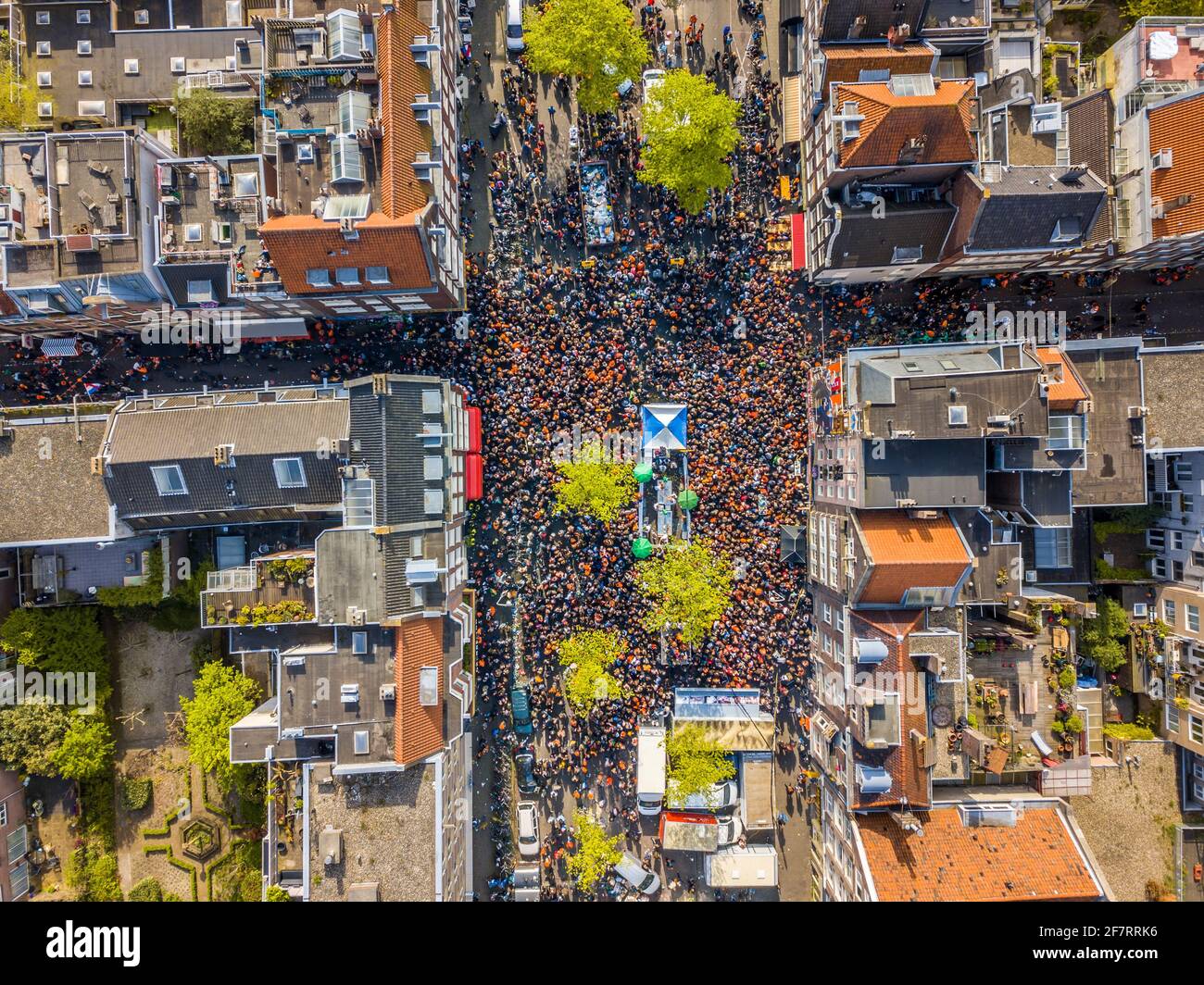 Aerial view of Huge crowd in Westerstraat on Koningsdag Kings day festivities in Amsterdam. Birthday of the king. Seen from helicopter. Stock Photo
