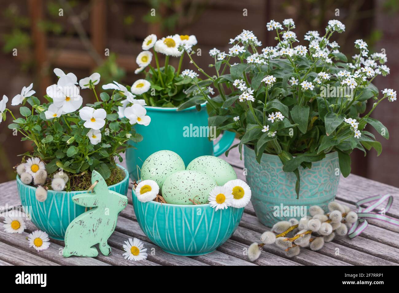 easter decoration with easter eggs and white spring flowers Stock Photo