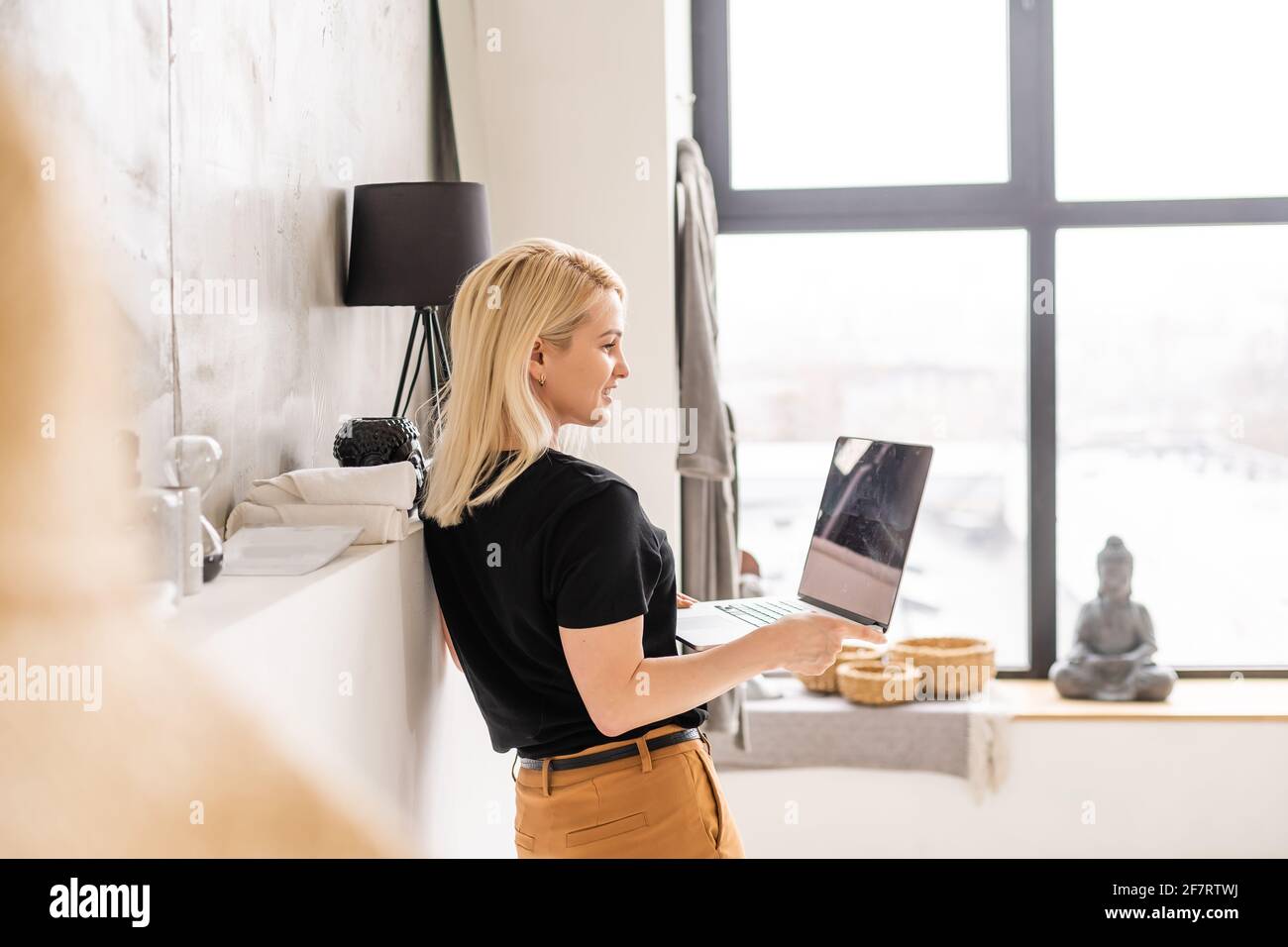 young beautiful woman using a laptop computer at home Stock Photo - Alamy