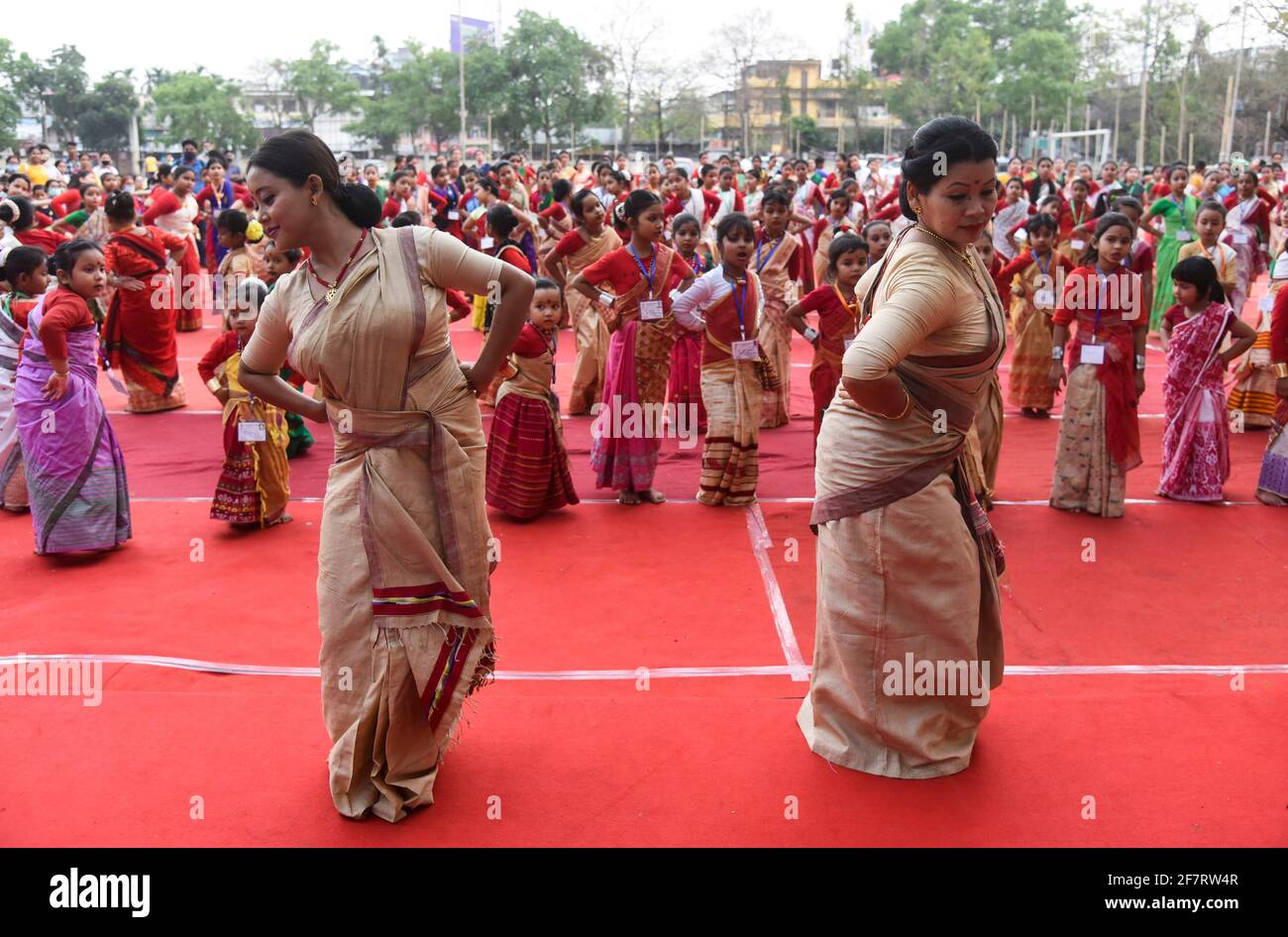 Assam, India. 9th Apr 2021. Woman and girls dancing as they are participated in a Bihu folk dance workshop ahead of Rongali Bihu Festival on April 09, 2021 in Guwahati, Assam, India. Bihu dance is an indigenous folk dance from the Indian state of Assam related to the Bihu festival and an important part of Assamese culture. Credit: David Talukdar/Alamy Live News Stock Photo