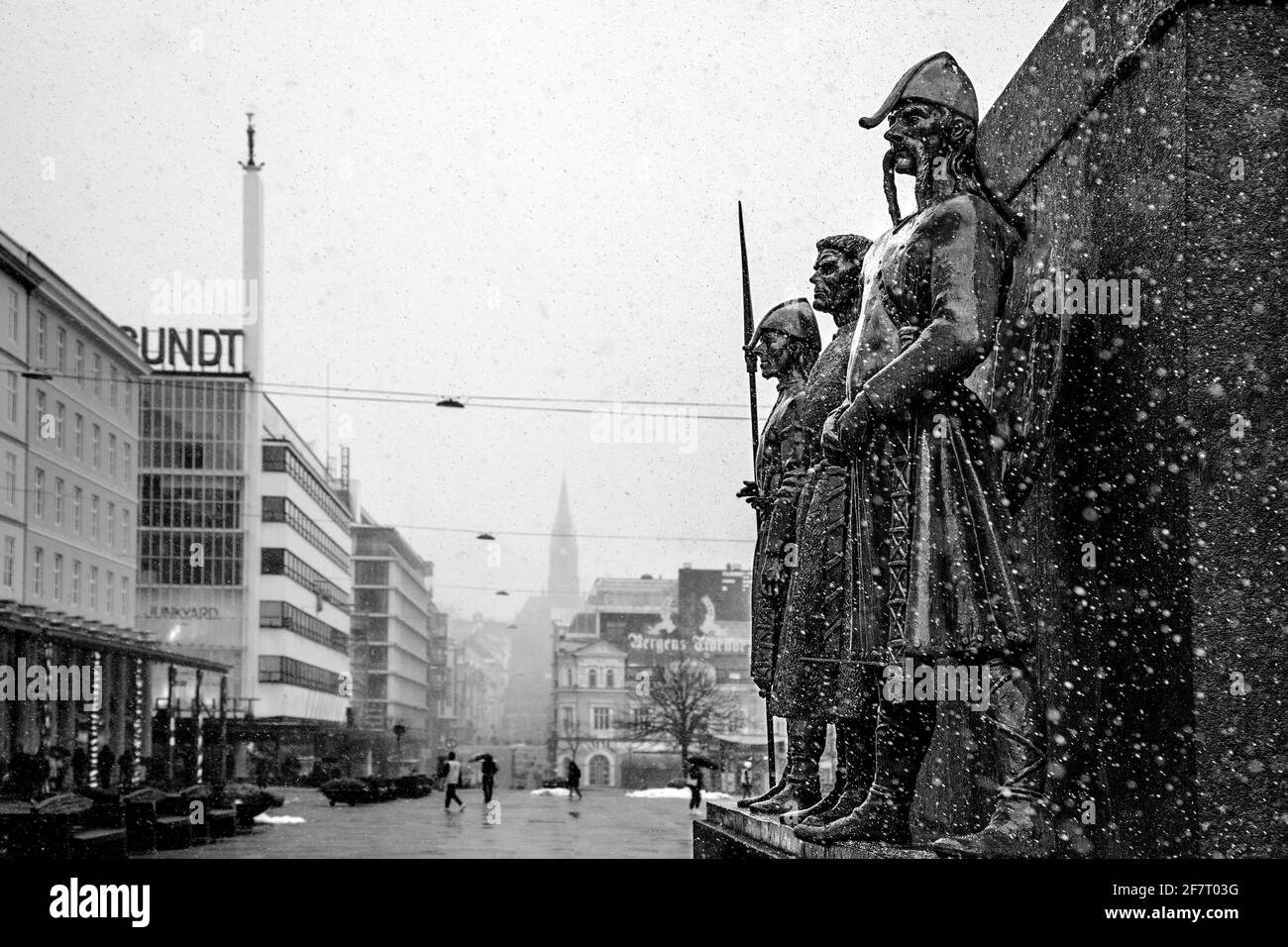 Snowy weather over three of the statues at Sailor's Monument at Torgalmenningen square in downtown Bergen, Norway. Stock Photo