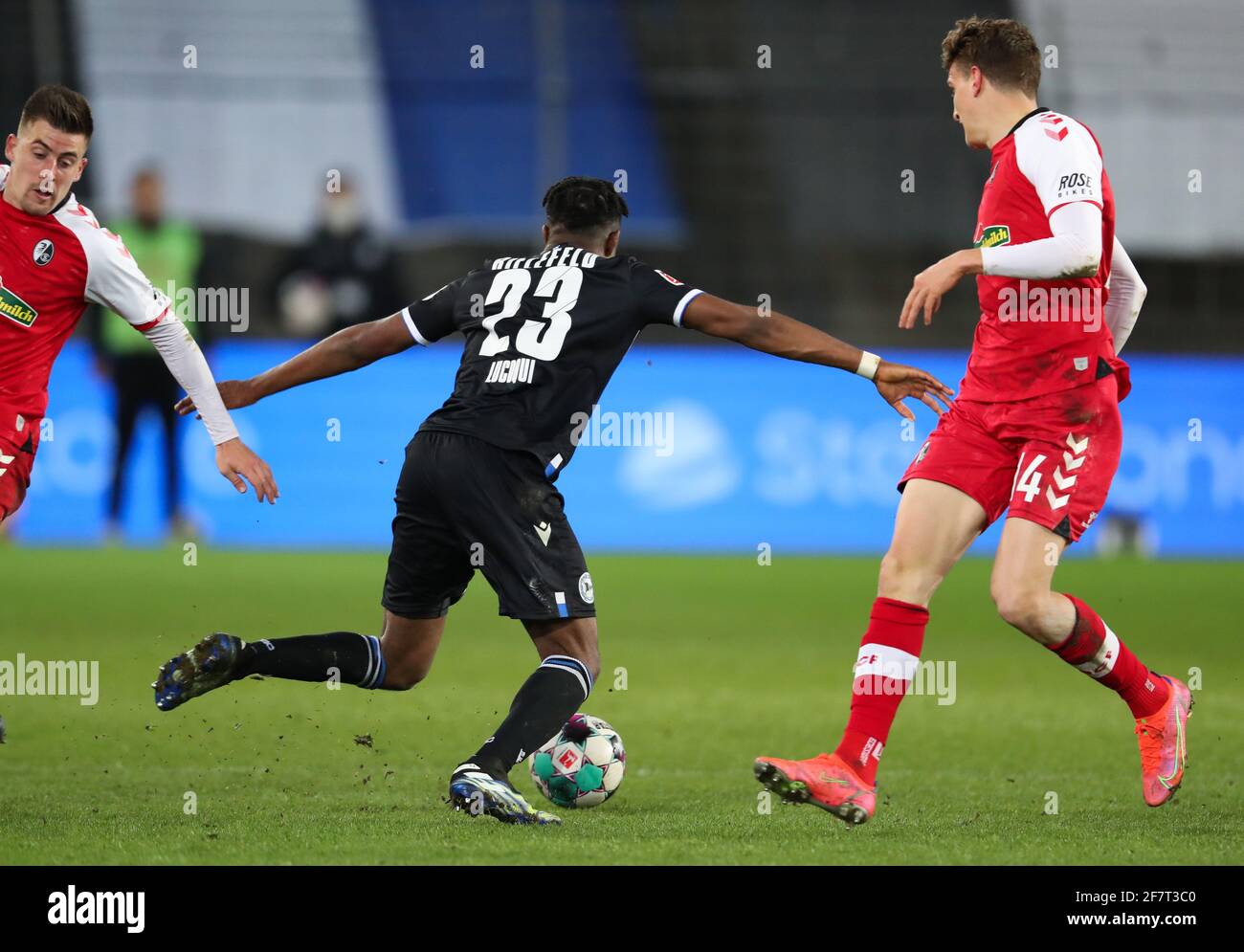 Bielefeld, Germany. 09th Apr, 2021. Football: Bundesliga, Arminia Bielefeld - SC Freiburg, Matchday 28 at Schüco Arena. Freiburg's Baptiste Santamaría and Freiburg's Guus Til (r) in action against Bielefeld's Anderson Lucoqui. IMPORTANT NOTE: In accordance with the regulations of the DFL Deutsche Fußball Liga and the DFB Deutscher Fußball-Bund, it is prohibited to use or have used photographs taken in the stadium and/or of the match in the form of sequence pictures and/or video-like photo series. Credit: Friso Gentsch/dpa/Alamy Live News Stock Photo