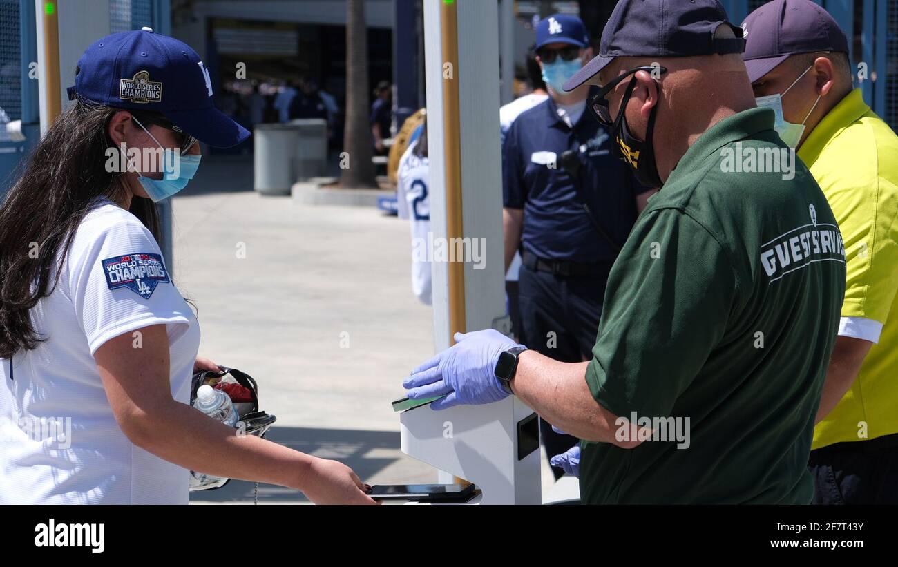 Los Angeles, CA, USA. 9th Apr, 2021. A fan scans her ticket on her phone at the Dodgers home opening game against the Nationals on Friday. The Dodgers opened up the stadium for the first time in 18 months with new COVID-19 fan guidelines including mobile tickets. Credit: Young G. Kim/Alamy Live News Stock Photo