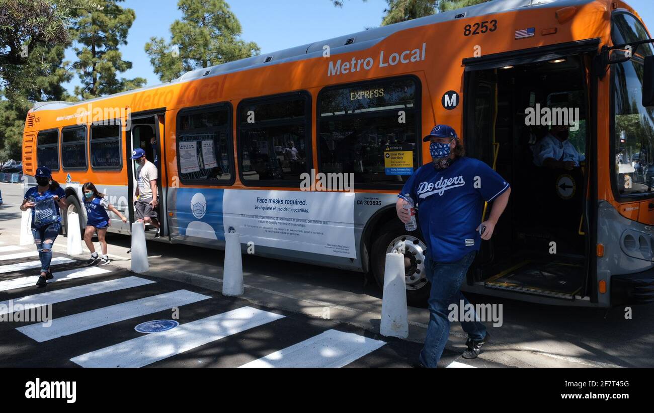 Los Angeles, CA, USA. 9th Apr, 2021. Fans get off the Metro Dodger Stadium Express bus at the Dodgers home opening game against the Nationals on Friday. The Dodgers opened up the stadium for the first time in 18 months with new COVID-19 fan guidelines. Credit: Young G. Kim/Alamy Live News Stock Photo
