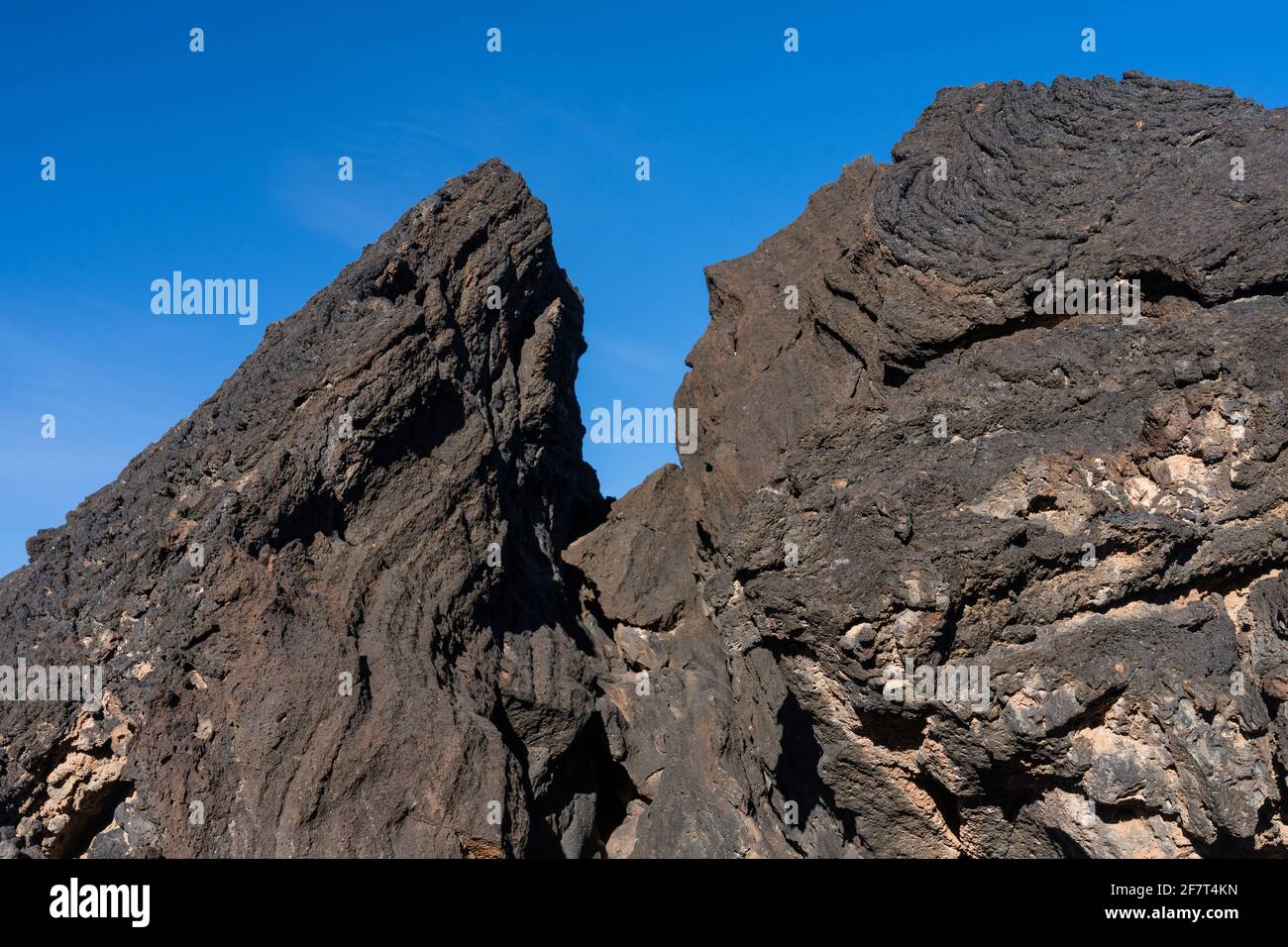 Giant boulders of Pahoehoe lava, which looks like twisted rope, in the ...