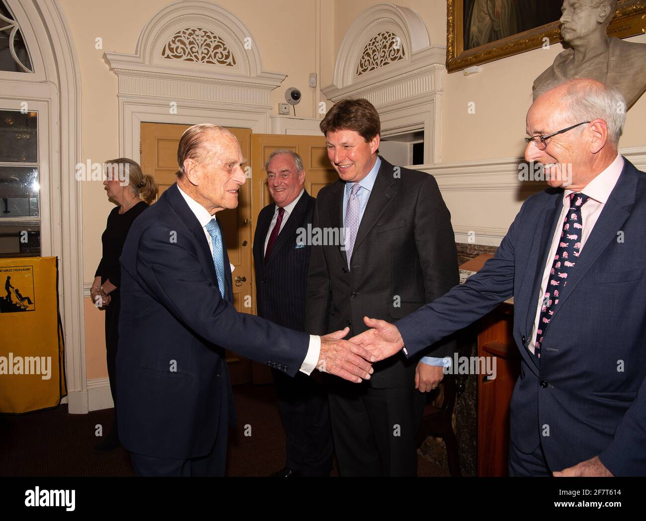 Windsor, Berkshire, UK. 11th April, 2017. HRH Prince Phillip, The Duke of Edinburgh meets trustee of the Prince Philip Trust Fund, Ross Wilson before a dinner at the Guildhall in Windsor this evening. Trustees and donors to the charity attended the event. The charity raises funds and distribute them to charities across the Royal Borough of Windsor & Maidenhead in Berkshire. Credit: Maureen McLean/Alamy Stock Photo