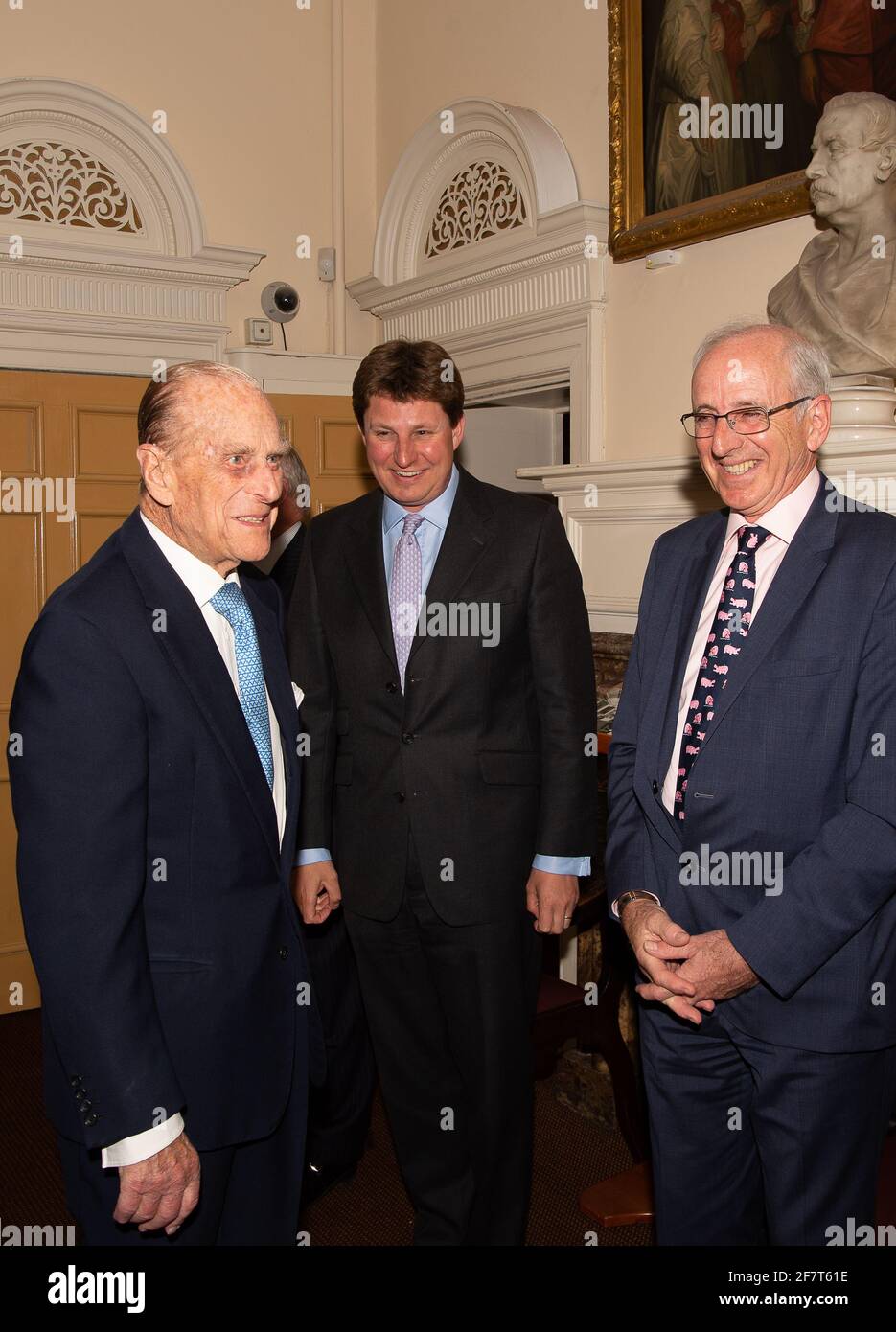 Windsor, Berkshire, UK. 11th April, 2017. HRH Prince Phillip, The Duke of Edinburgh meets trustee of the Prince Philip Trust Fund, Ross Wilson (R) before a dinner at the Guildhall in Windsor this evening. Trustees and donors to the charity attended the event. The charity raises funds and distribute them to charities across the Royal Borough of Windsor & Maidenhead in Berkshire. Credit: Maureen McLean/Alamy Stock Photo