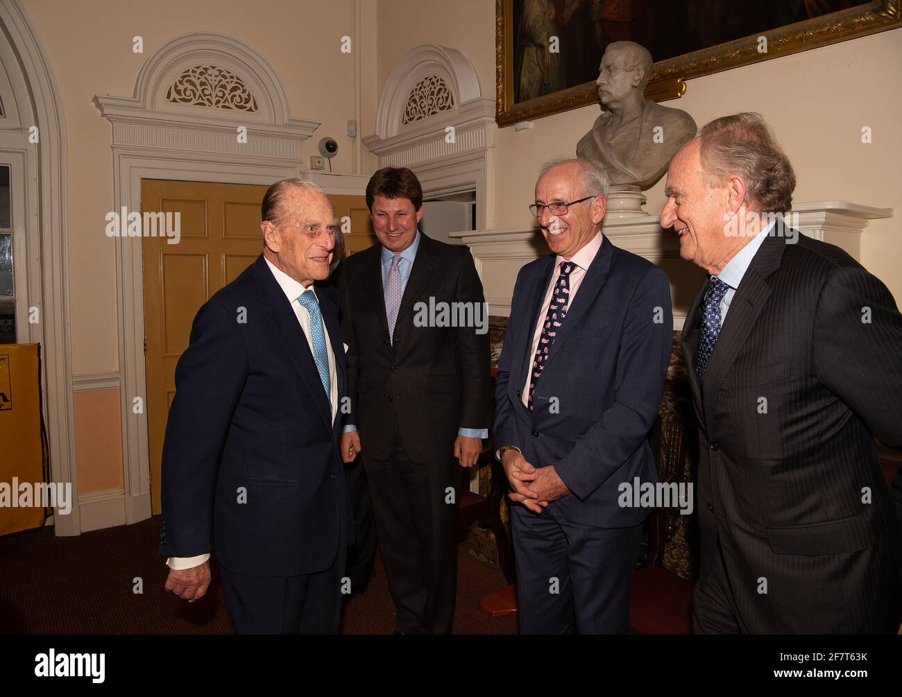 Windsor, Berkshire, UK. 11th April, 2017. HRH Prince Phillip, The Duke of Edinburgh meets trustee of the Prince Philip Trust Fund, Ross Wilson (3rd R) and trustee Andrew Panter (4th R) before a dinner at the Guildhall in Windsor this evening. Trustees and donors to the charity attended the event. The charity raises funds and distribute them to charities across the Royal Borough of Windsor & Maidenhead in Berkshire. Credit: Maureen McLean/Alamy Stock Photo