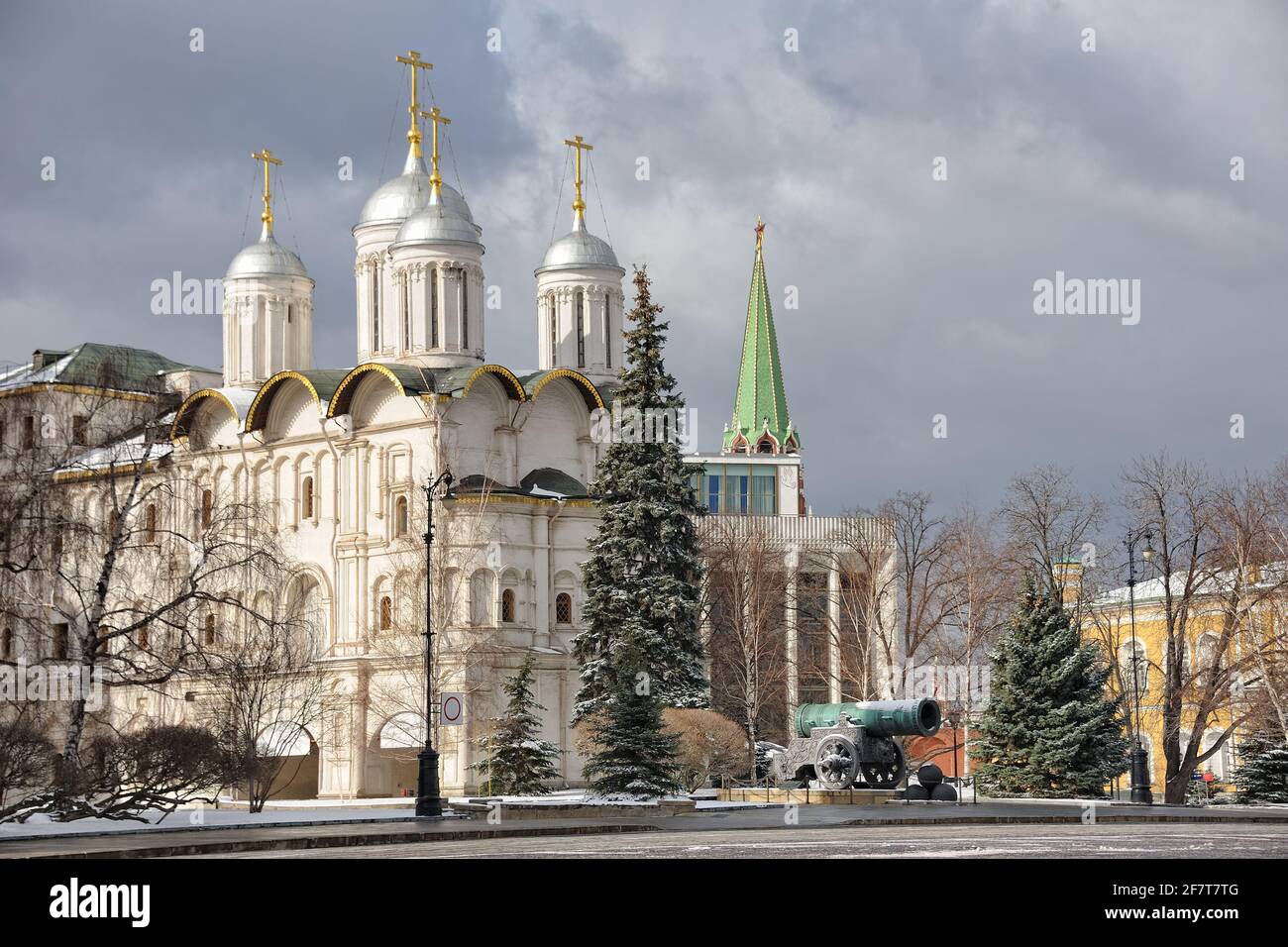 = Twelve Apostles' Cathedral and Tsar Cannon in Winter =  View from Ivan Square on the architectural ensemble of Moscow Kremlin with the Cathedral of Stock Photo