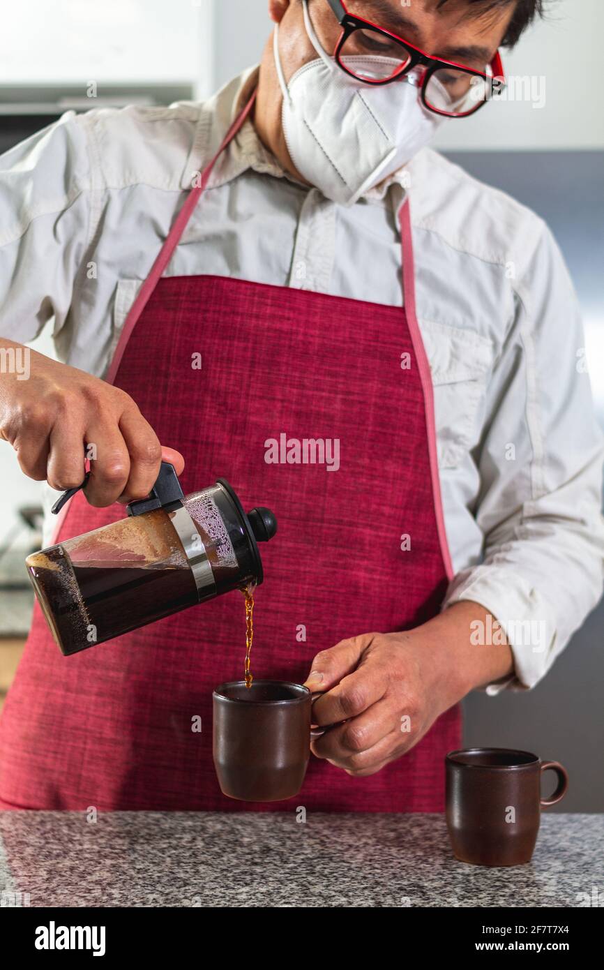 Man serving coffee from a moka pot Stock Photo by ©nito103 117806646