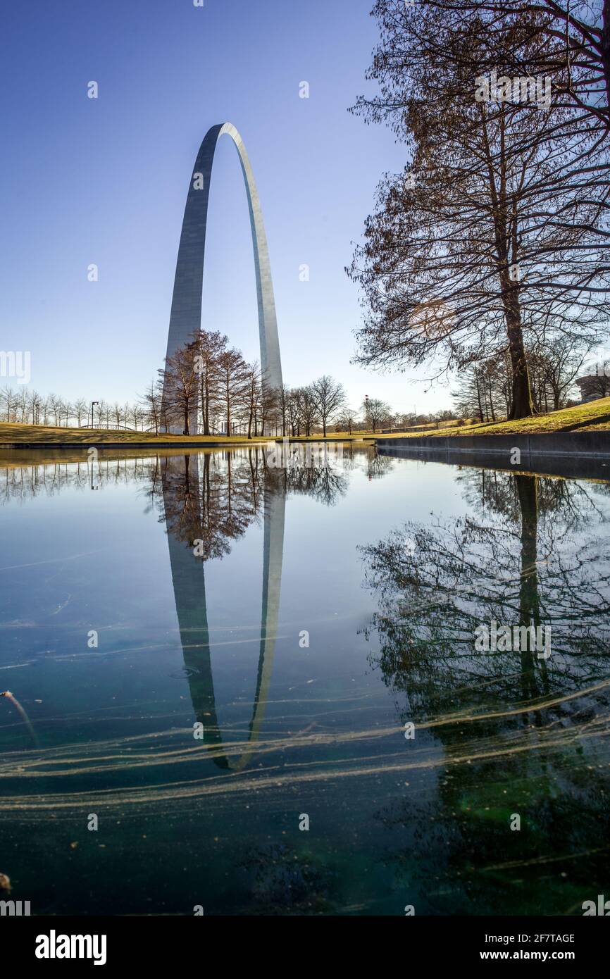 The Gateway Arch reflects on water in Gateway Arch National Park, St. Louis, Missouri Stock Photo