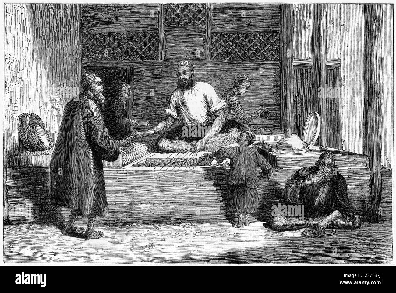 Engraving of a man selling kebabs from his store on the streets of Cabul, Afghanistan, circa 1879 Stock Photo