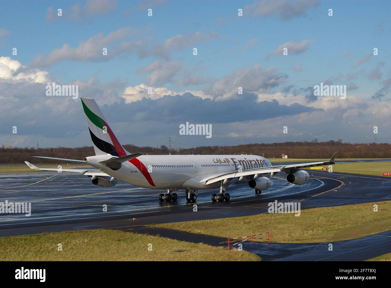Düsseldorf, Germany - February 24, 2007: Airbus A340-313X of Emirates at the airport of Düsseldorf reaching the runway after taxiing Stock Photo