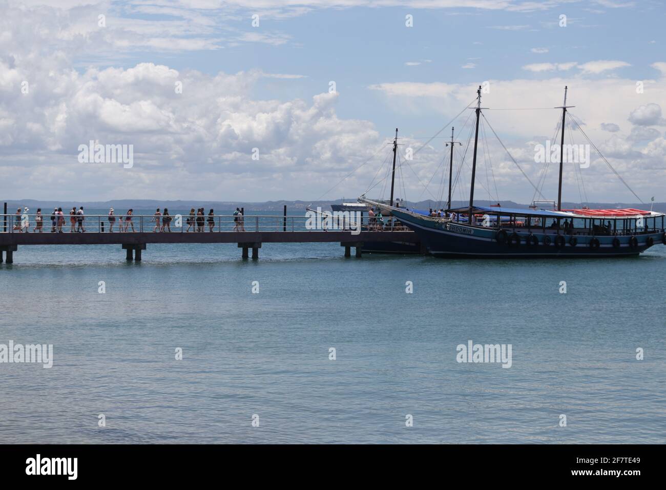 salvador, bahia / brazil  - january 31, 2019: Passengers are seen at the pier of Ilha dos Frades schooning for schooner for a nautical ride through th Stock Photo