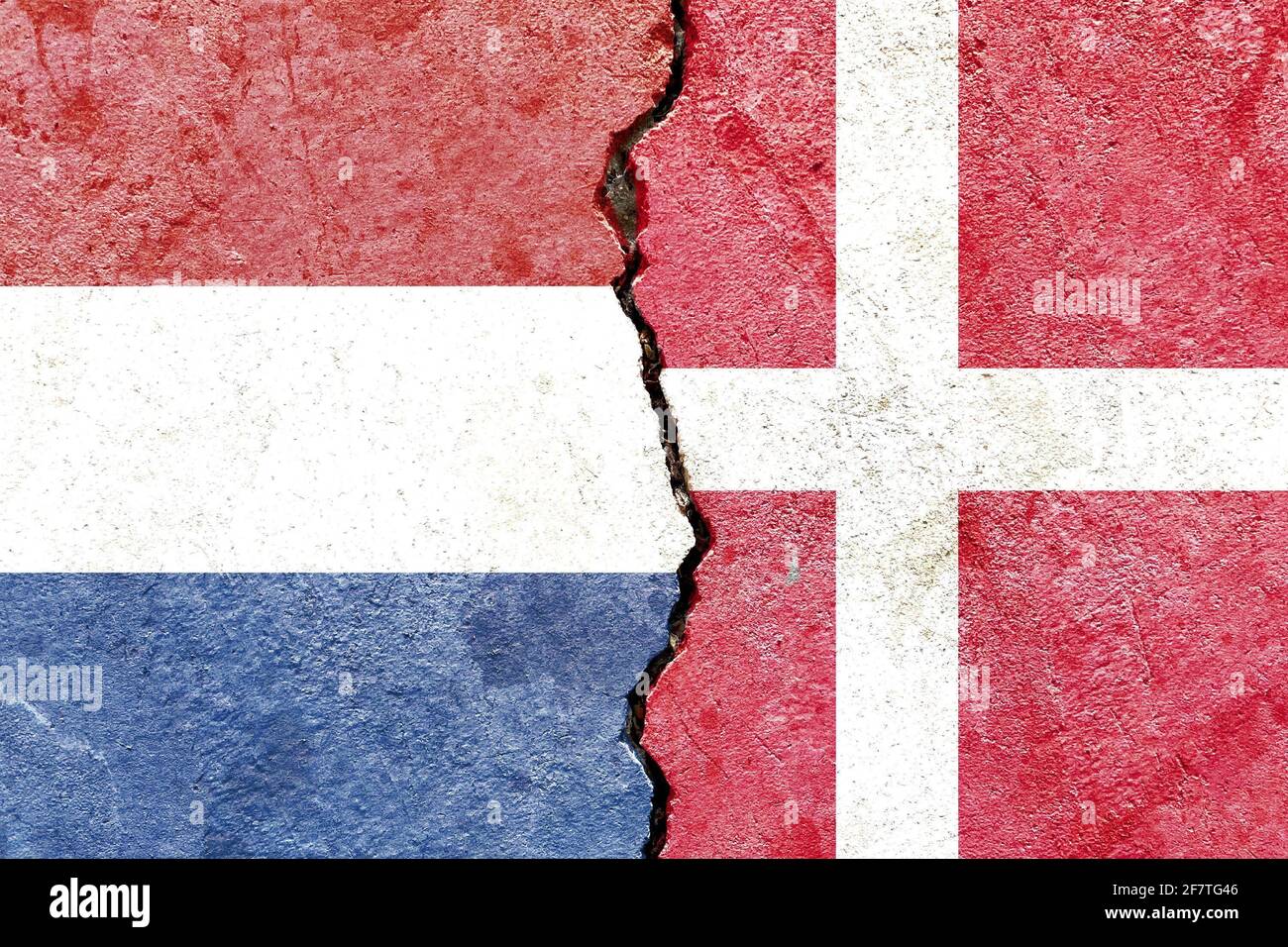 Flags of the Netherlands and Denmark isolated on cracked wall ...