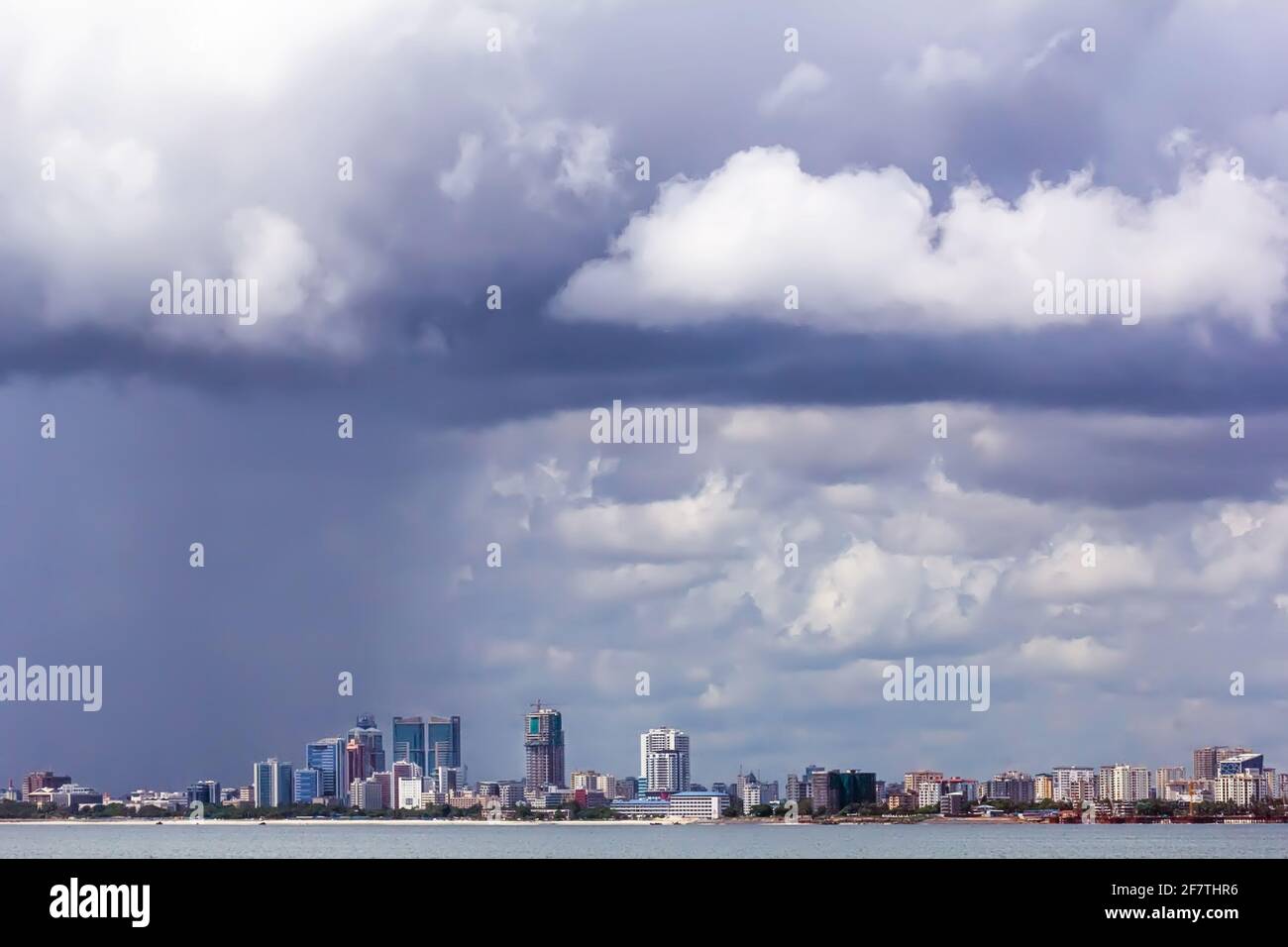 March, 20, 2020 - Dar Es Salaam, Tanzania: panorama of Dar Es Salaam from the water under a stormy sky Stock Photo