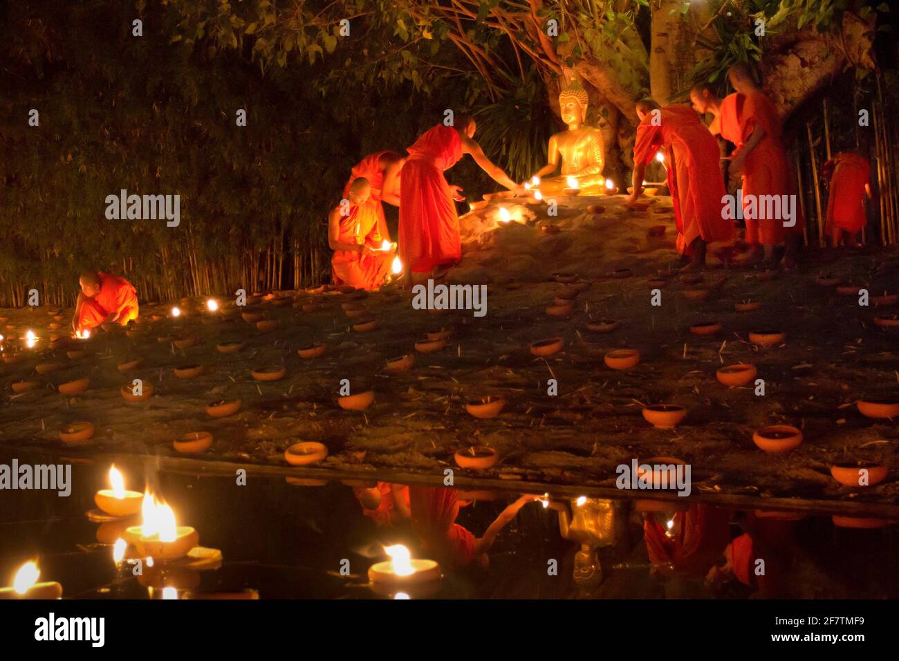 Monk light candle in Makha bucha and Visakha bucha day, chiangmai, thailand. Stock Photo