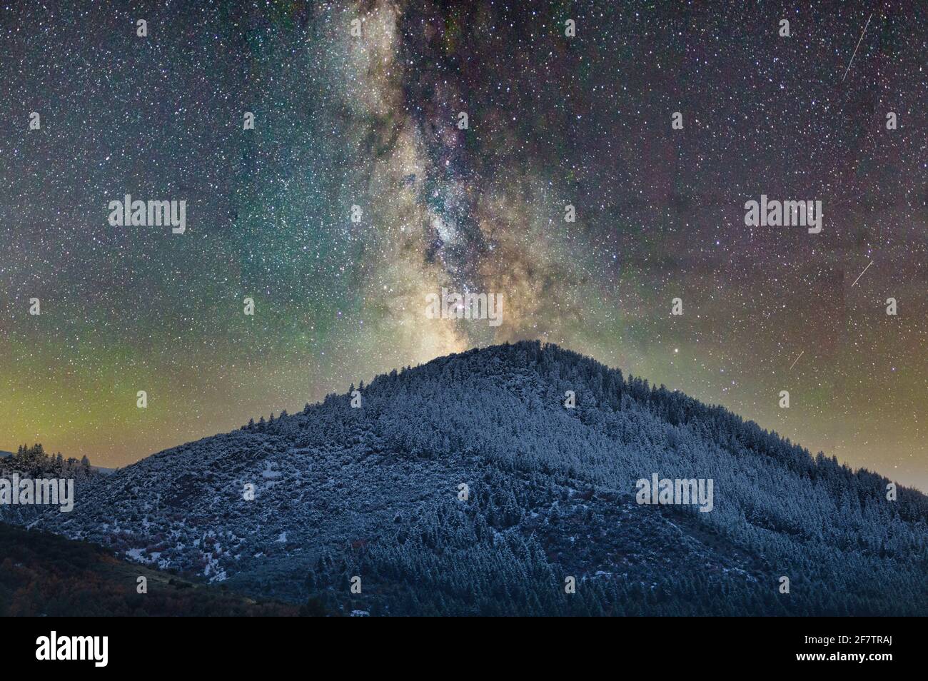 Beautiful view of the Milky Way Galaxy over a landscape with hills ...