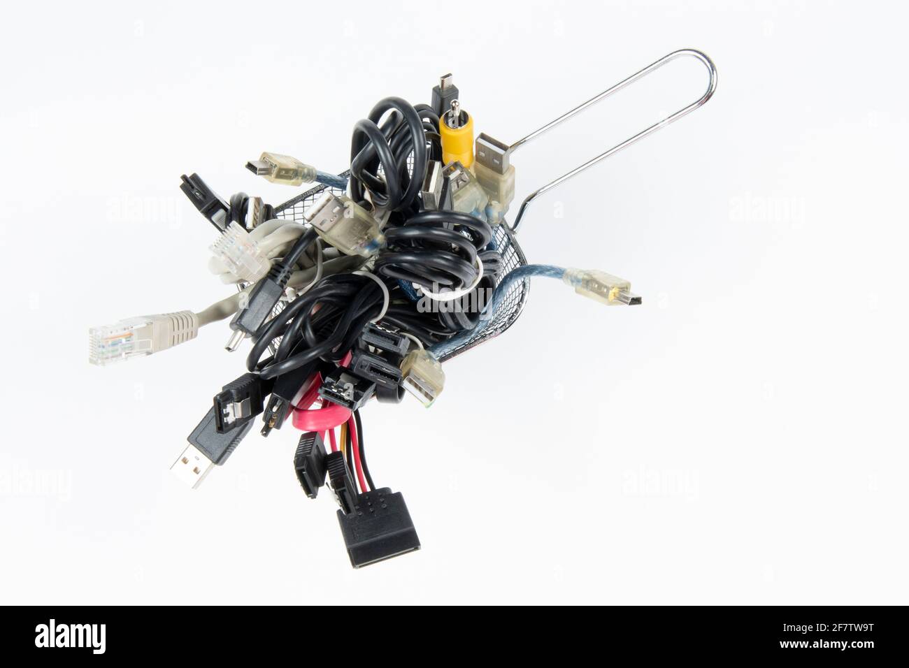 technological waste that remains in residence as computer cables Stock Photo