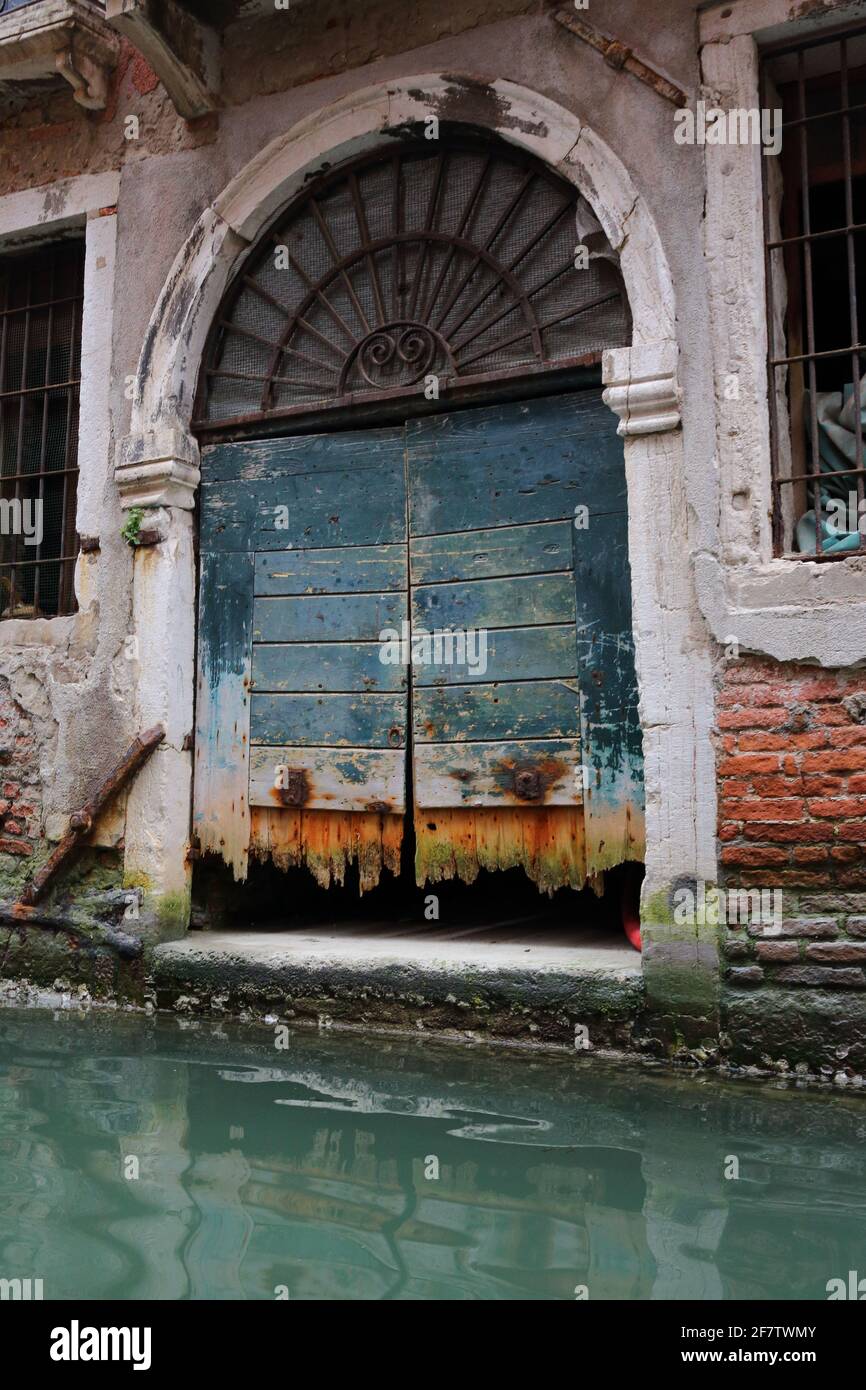 Photo of Venice door taken in 2015, before the bottom was fixed. Stock Photo