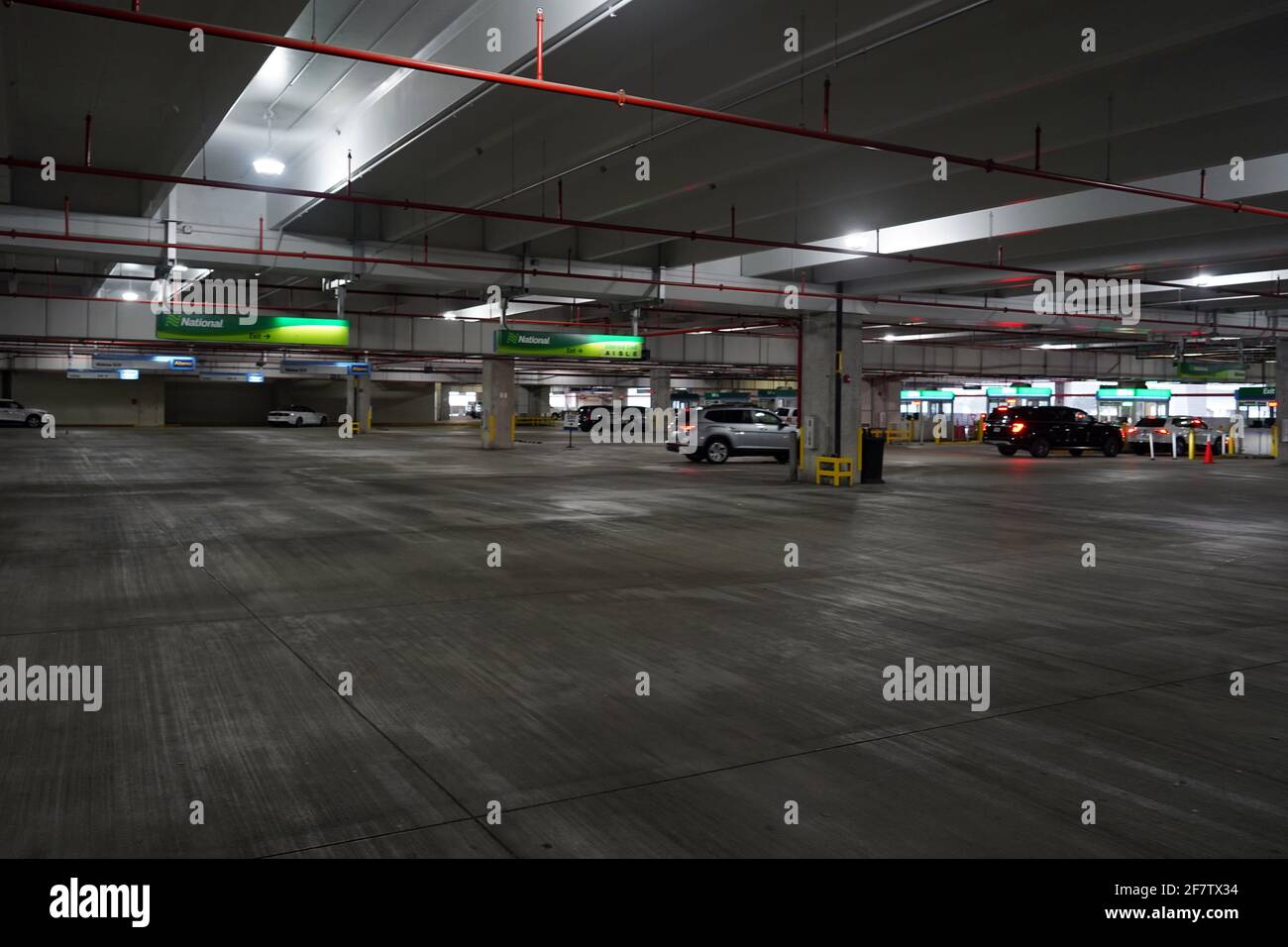 Empty parking stalls at National Rental Car at the Miami International Airport rental car center, Friday, April 9, 2021, in Miami. Stock Photo