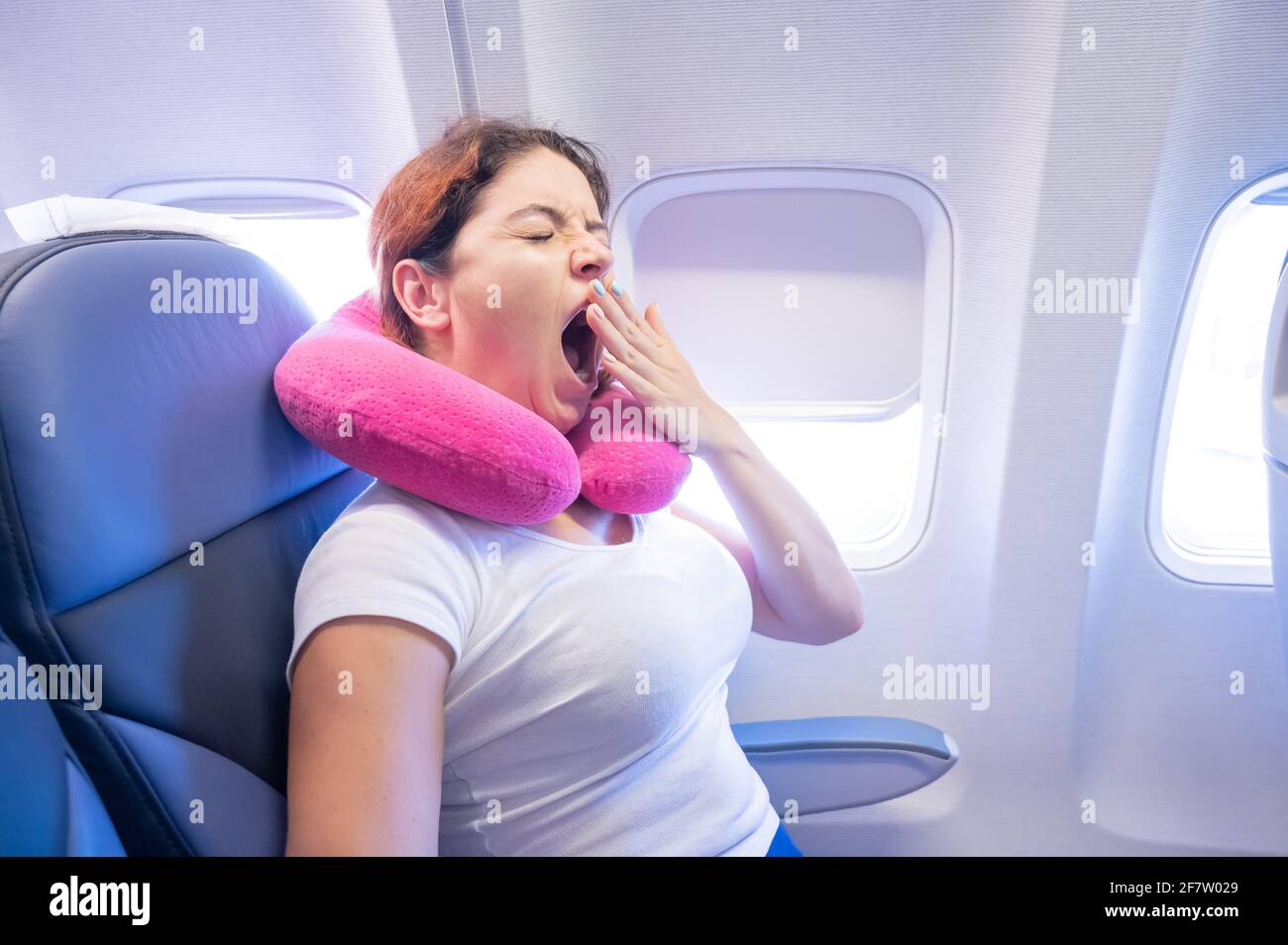 Sleepy woman inside plane hi-res stock photography and images - Alamy
