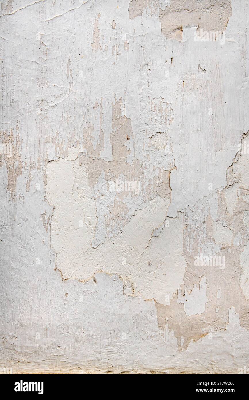 Weathered white plaster wall Stock Photo