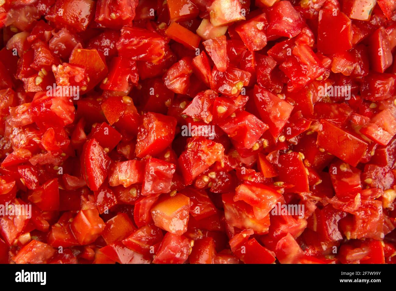 Closeup on red chopped tomato texture background Stock Photo