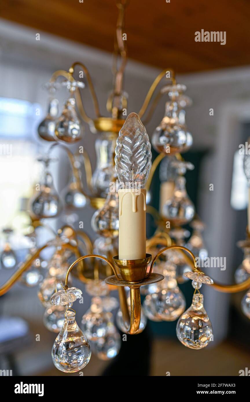 old crystal chandelier hanging from ceiling in retro home Stock Photo -  Alamy, image size:864x1390