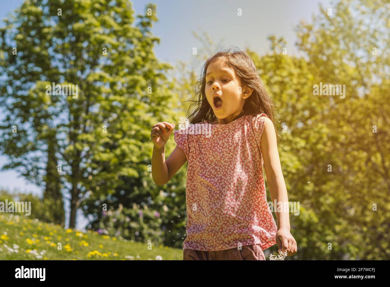 Portrait of a little girl playing in the park Stock Photo - Alamy