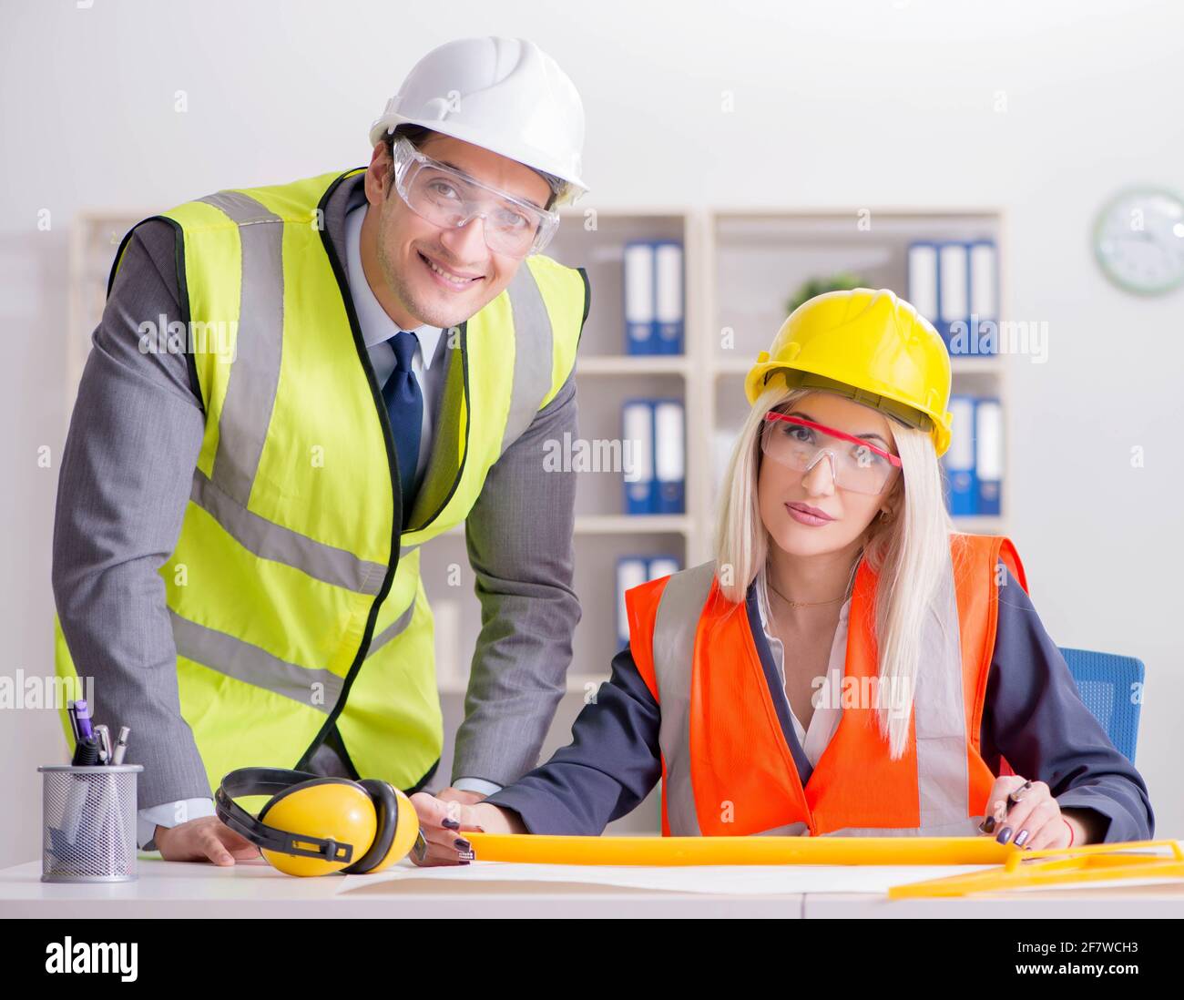 Construction workers having discussion in office before starting project Stock Photo