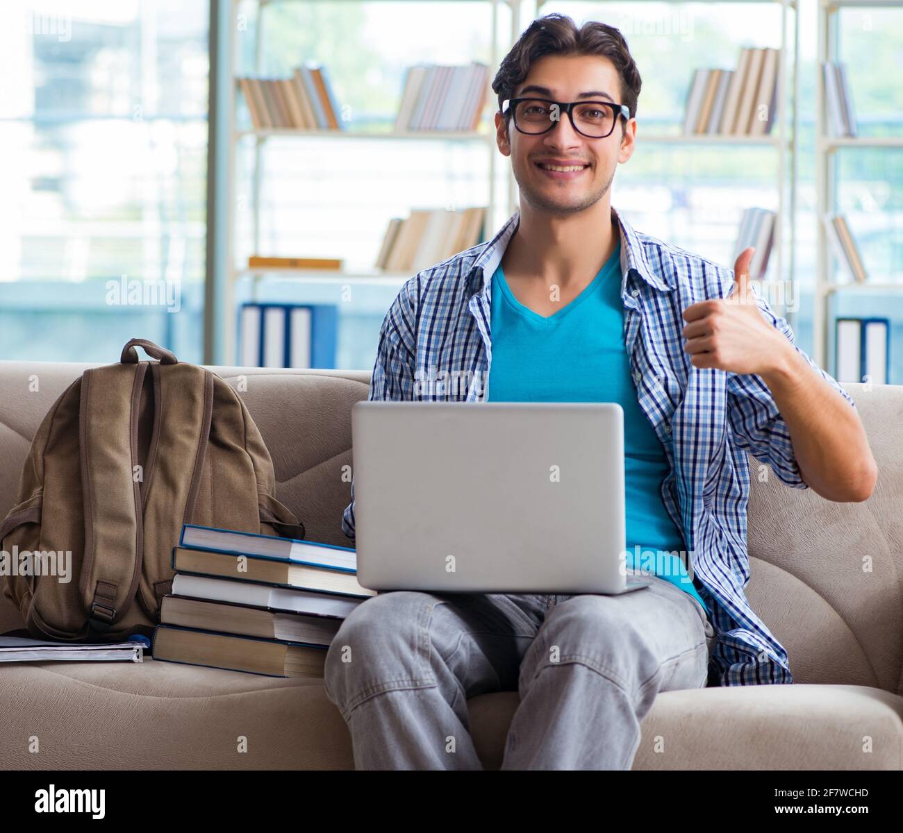 The caucasian student with laptop preparing for university exams Stock Photo Alamy