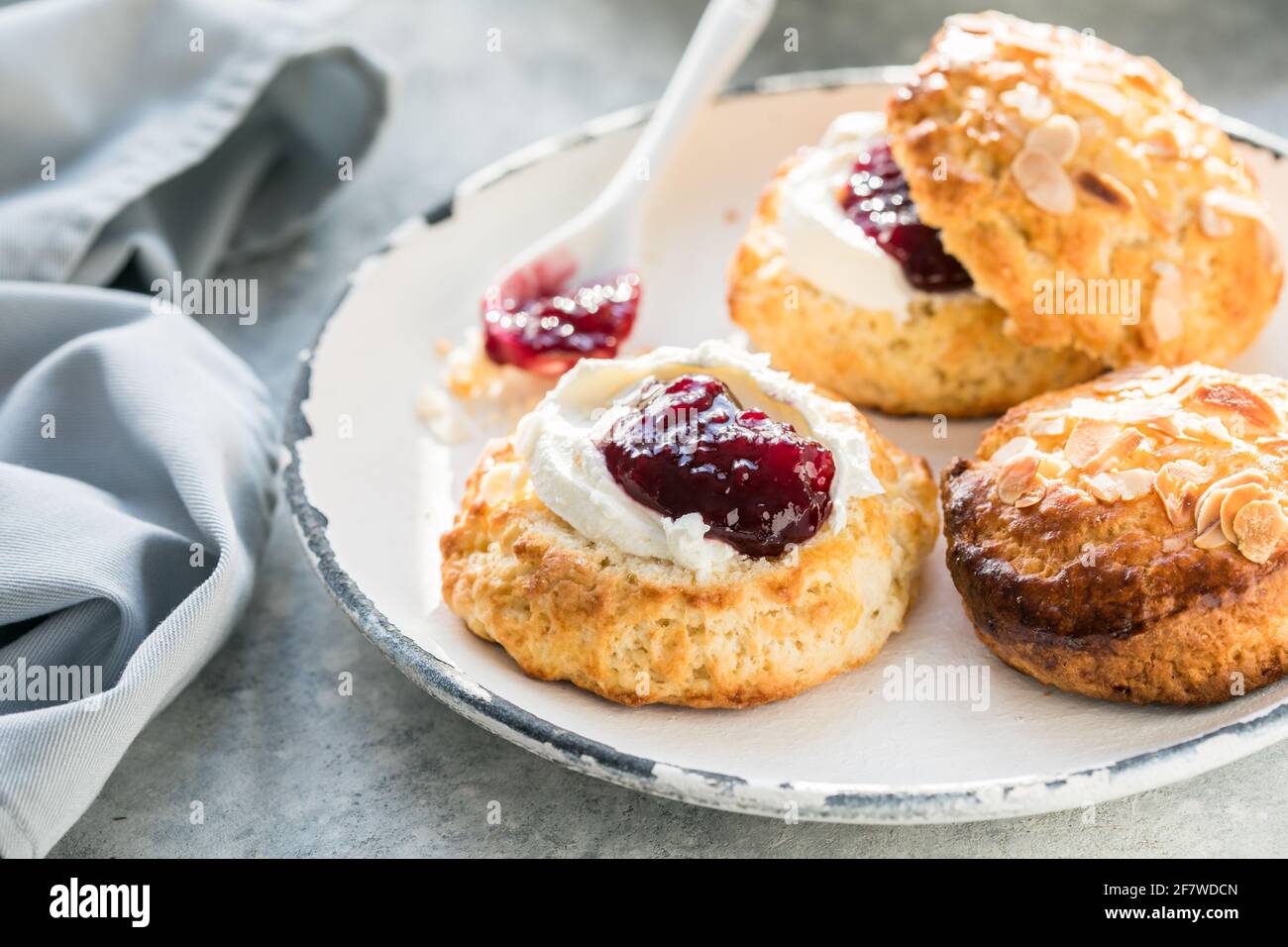 Traditional British Scones with clotted cream, raspberry jam Stock Photo Alamy
