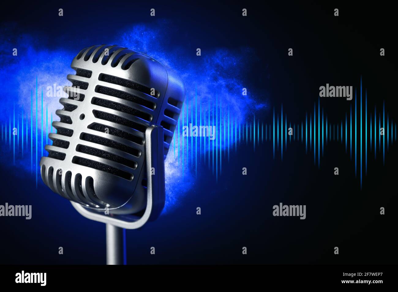 Retro microphone with radio waves on dark background Stock Photo - Alamy