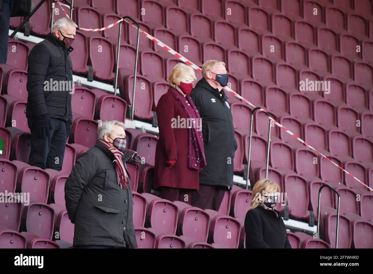 Tynecastle Park, Edinburgh, Scotland. UK. 9th April 21. Scottish Championship Match.Hearts vs Alloa Hearts owner Ann Budge & Partner Eric Hogg minute's silence before their game (Friday ) as a mark of respect for Prince Philip. Credit: eric mccowat/Alamy Live News Stock Photo