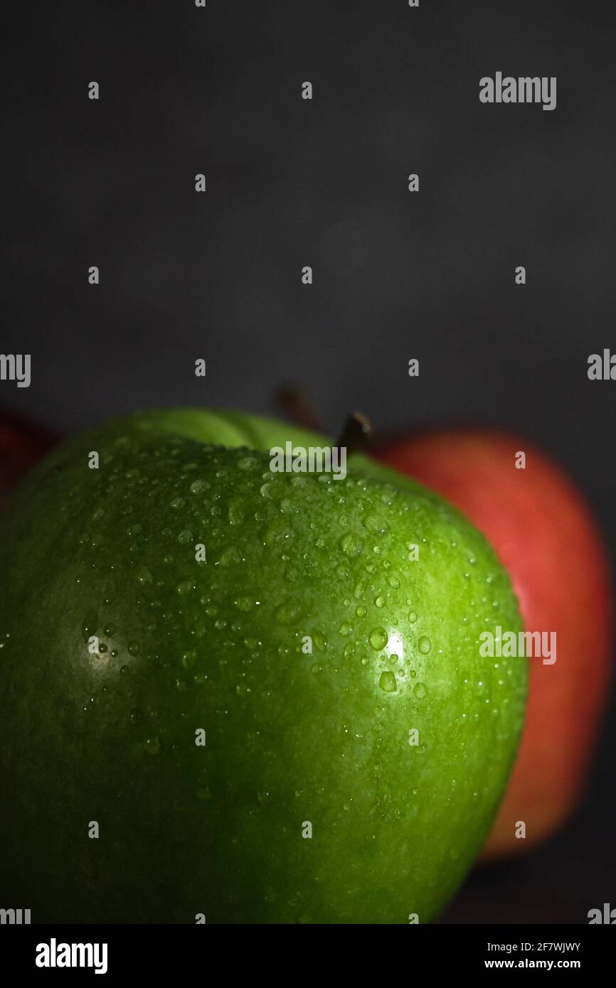green and red apple on dark background Stock Photo - Alamy