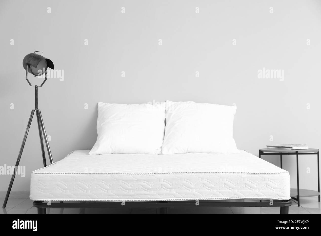Soft orthopedic mattress on bed in room Stock Photo Alamy